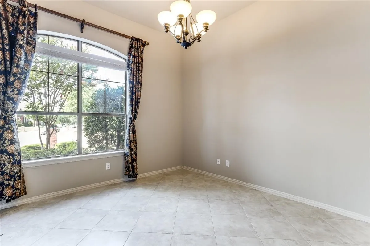 Arched window featuring multiple panes and exterior landscaping
