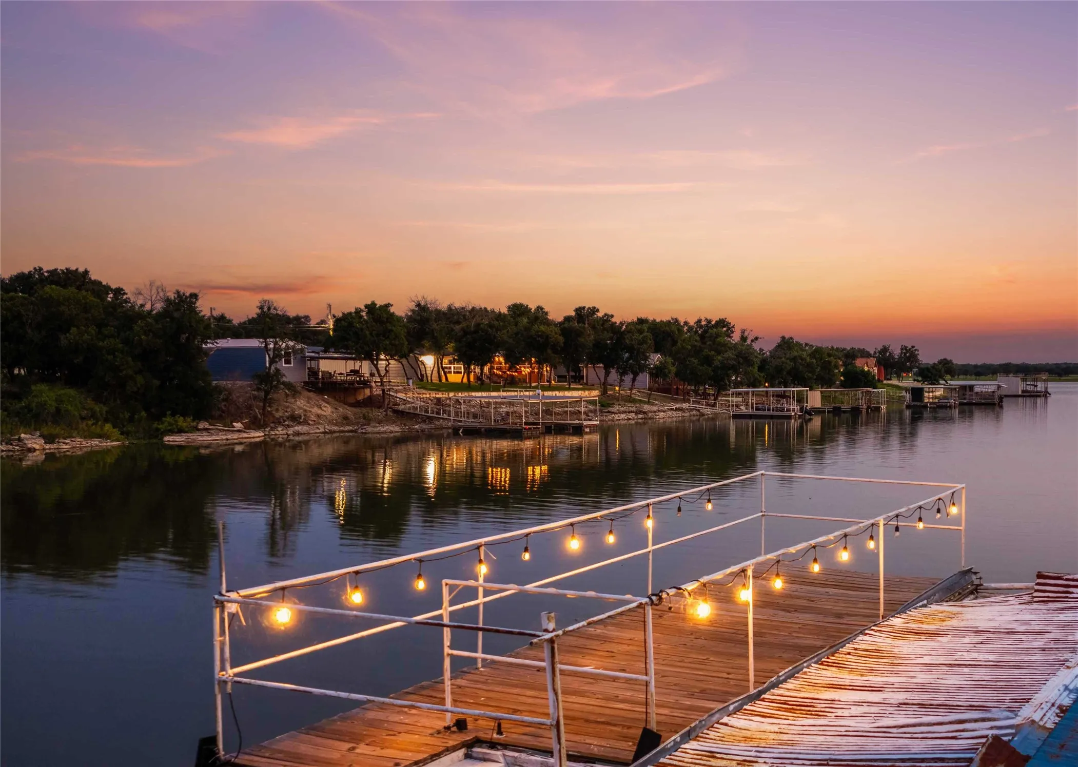 Enjoy evening sunsets from the two-story dock with open water lake views.