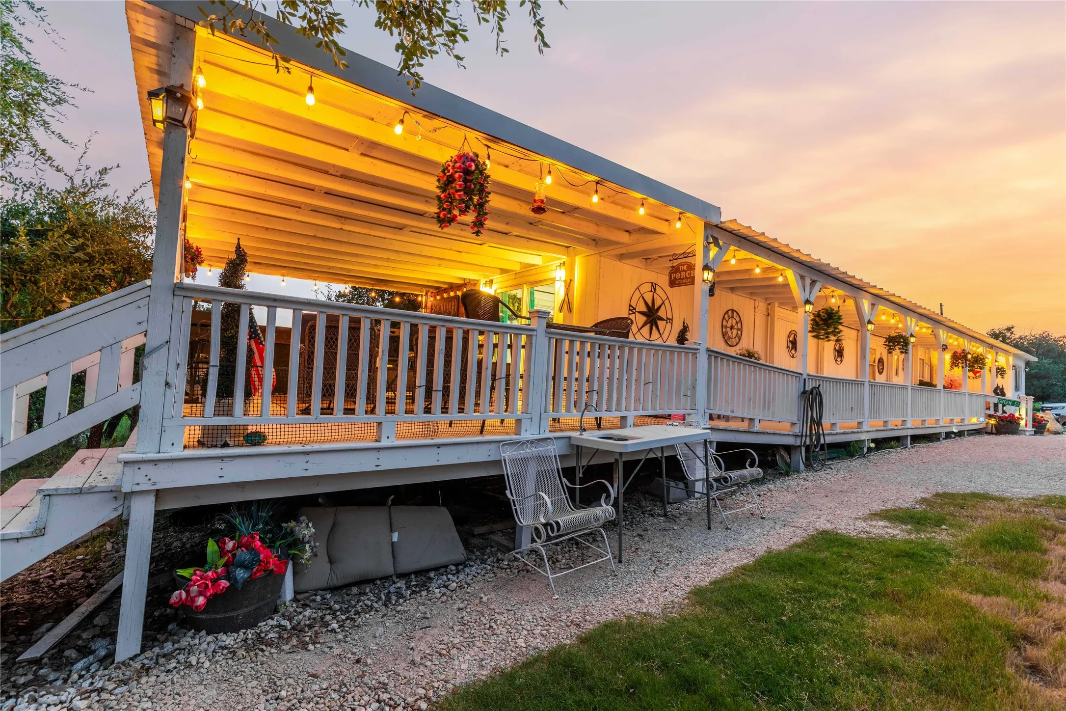 Nearly the entire length of the home is wrapped in covered porch space for outdoor living in every season.