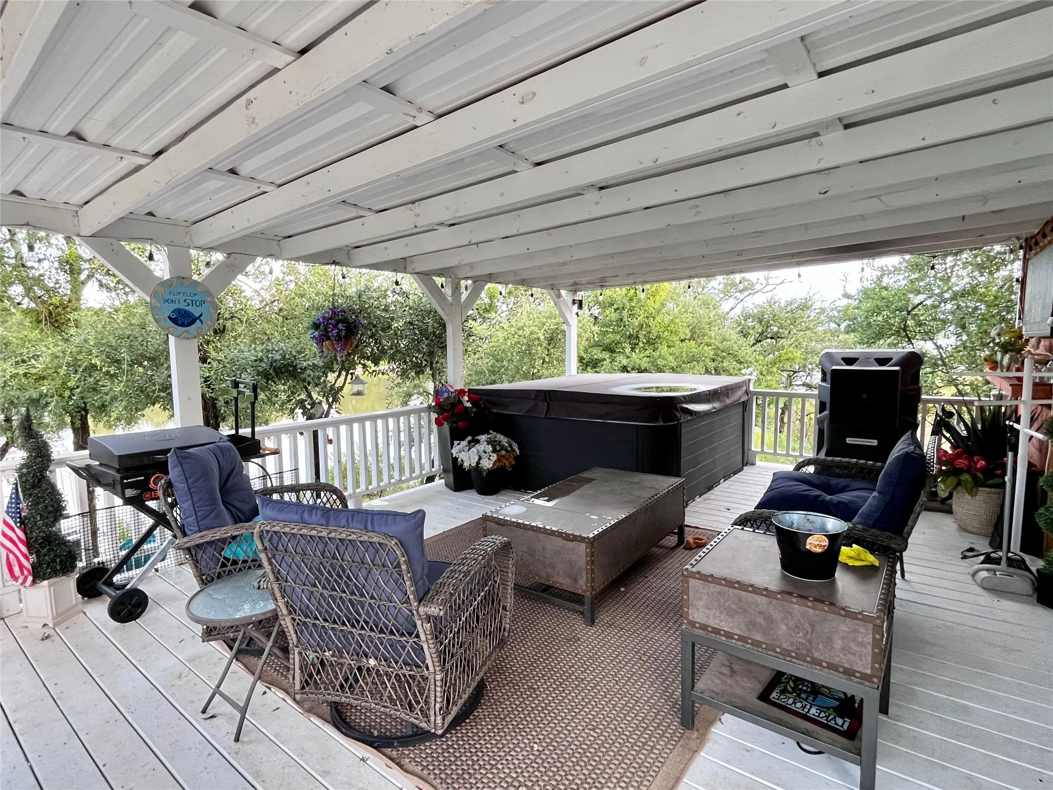 Covered lakeside entertaining area overlooks the water and provides the perfect place for morning coffee or evening gatherings.