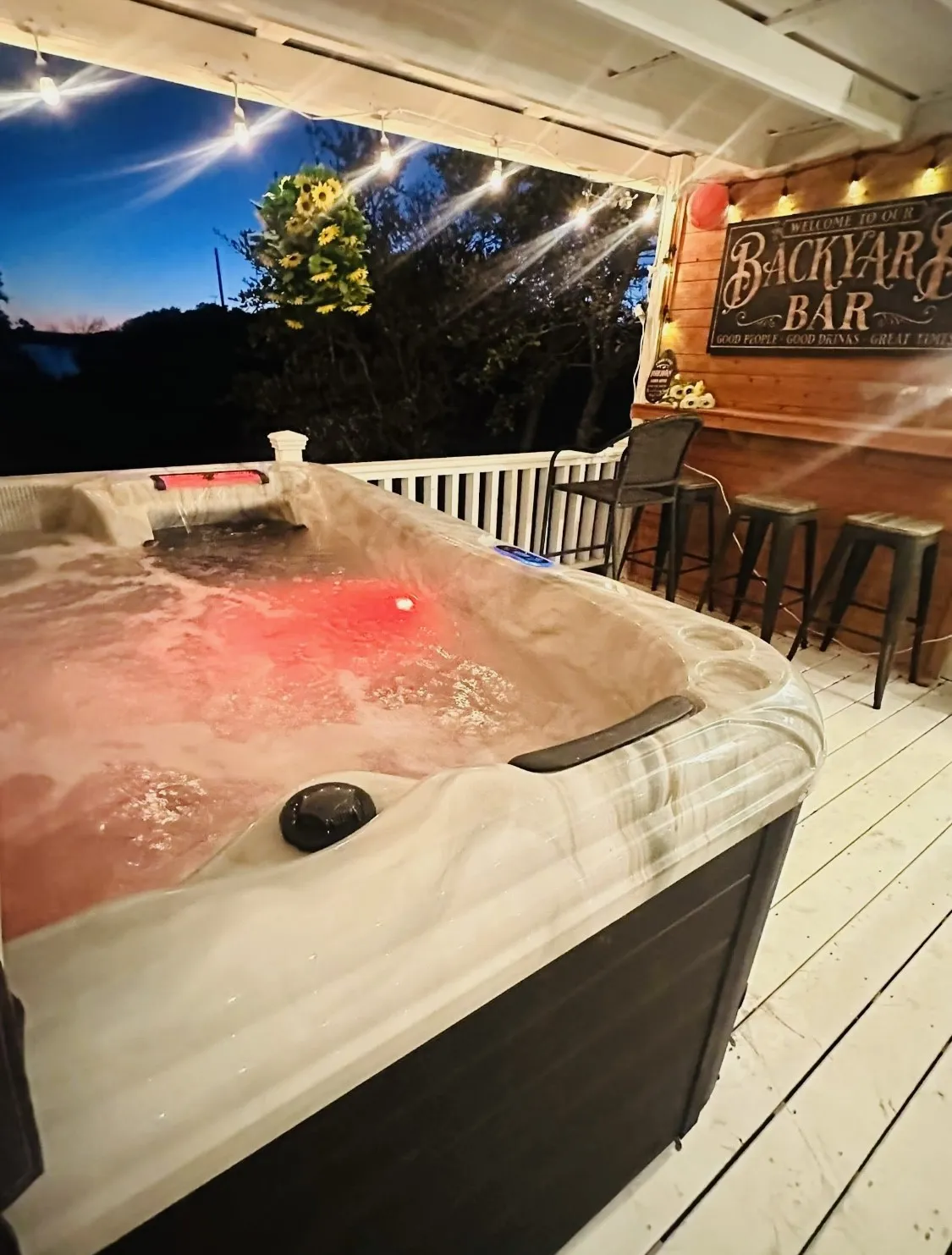 Unwind in the hot tub or entertain friends at the custom backyard bar overlooking the lake.