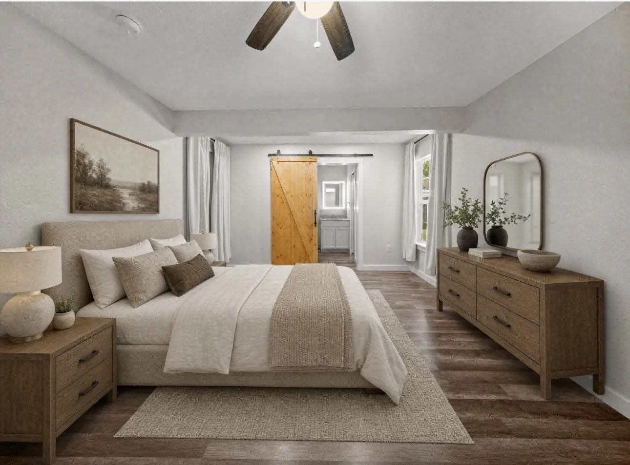 Spacious room featuring wood-finish flooring, a ceiling fan, and multiple windows with white trim