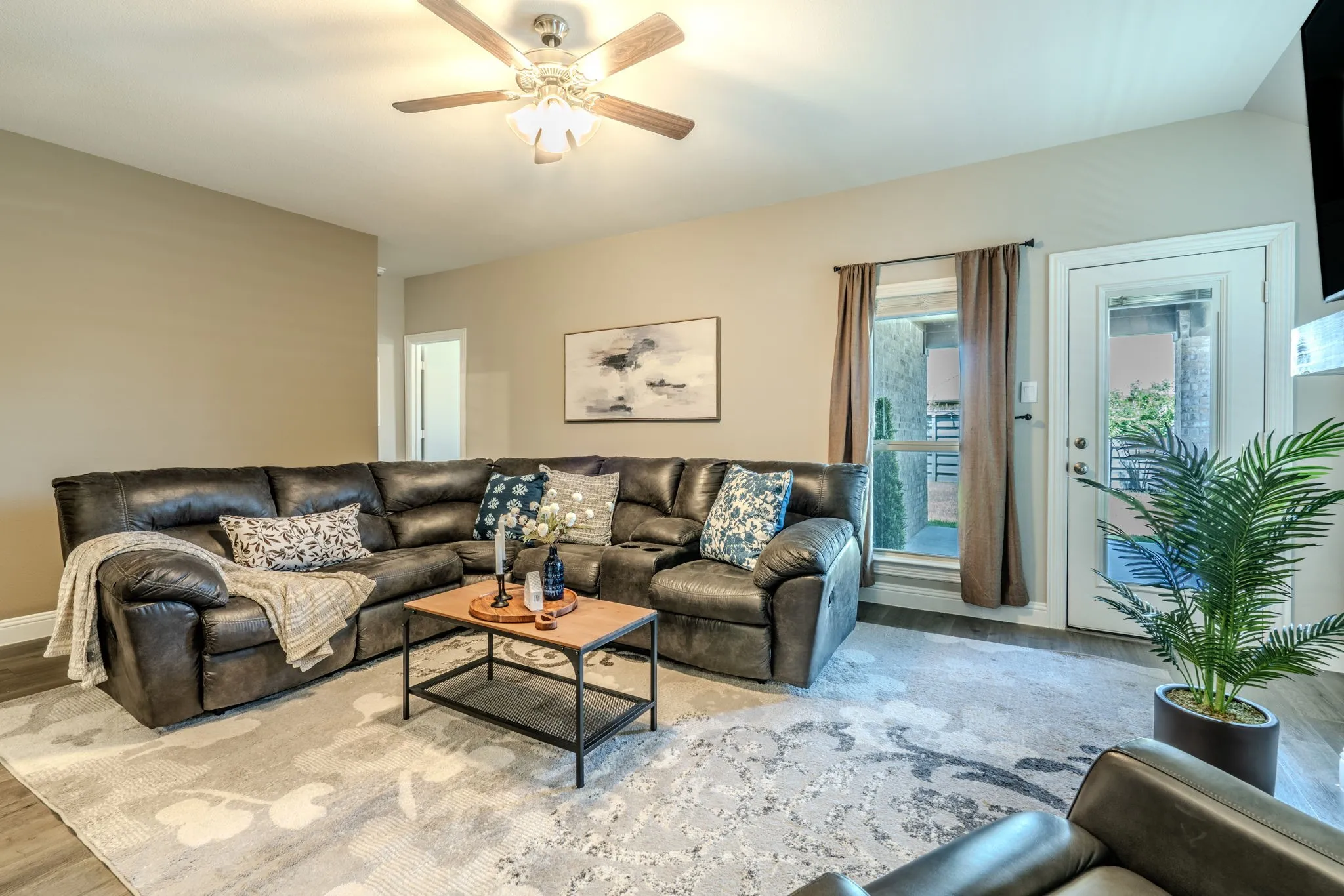 7329 Allium Court, Little Elm, TX 76227 - living room - Wood-finish flooring with a neutral wall palette