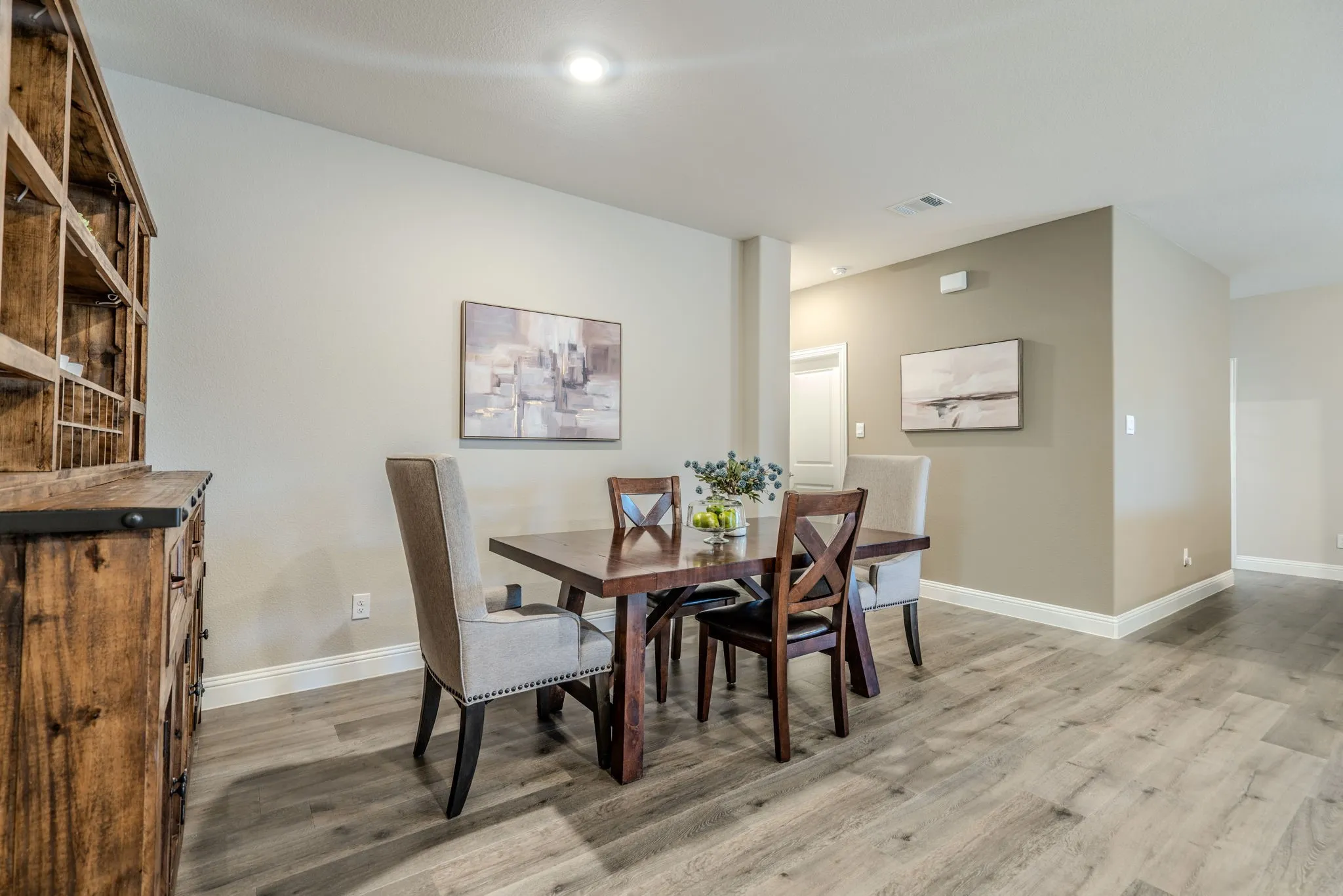 7329 Allium Court, Little Elm, TX 76227 - dining area - Dining area featuring a wood-finish dining table with upholstered chairs, recessed lighting, and wood-finish flooring throughout