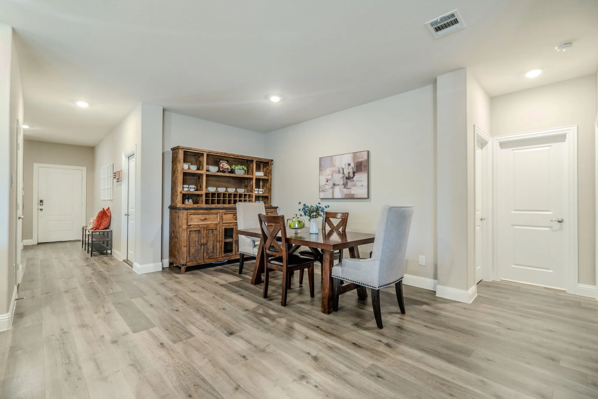 7329 Allium Court, Little Elm, TX 76227 - dining room - Wood-finish flooring throughout, recessed lighting, and crisp white trim