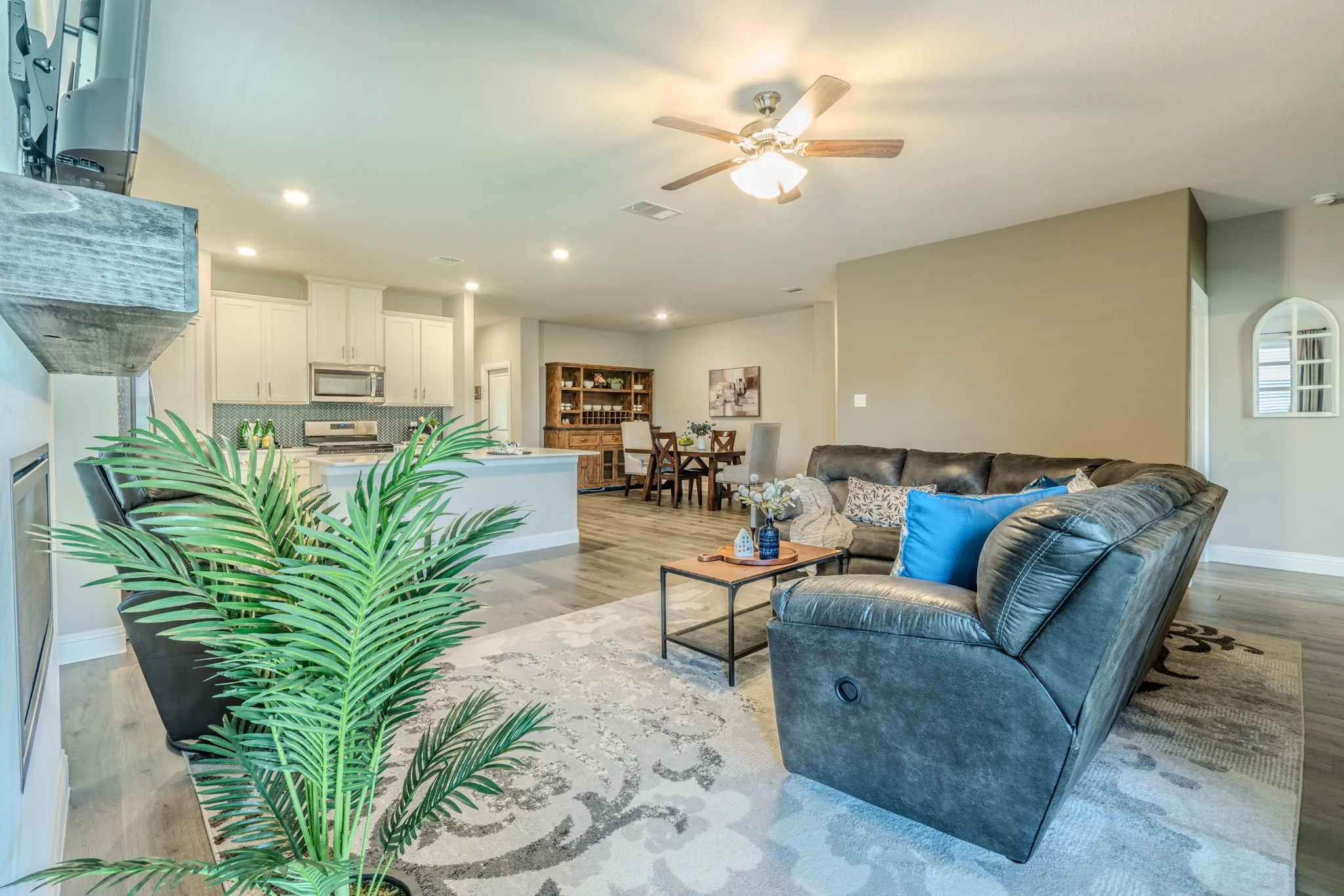 7329 Allium Court, Little Elm, TX 76227 - open area - Open-concept living space featuring wood-finish flooring, recessed lighting, and a ceiling fan