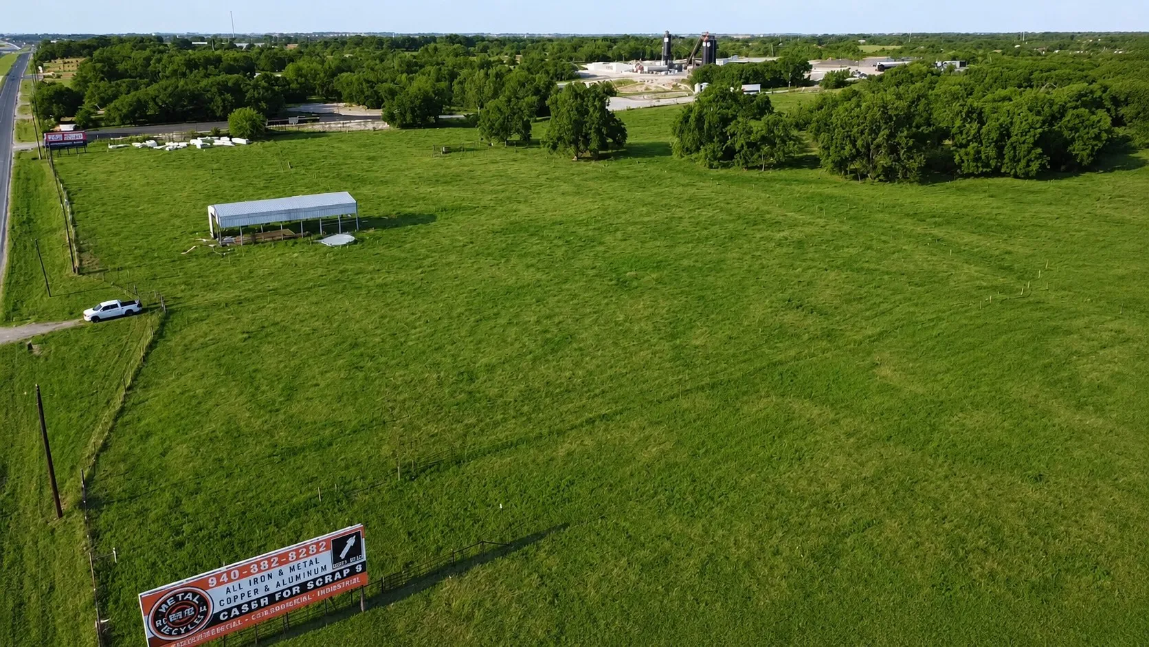 From the North side looking to the South side of the property. A fence divides on both sides.