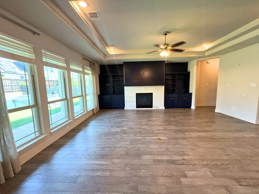 Living room with fireplace and built-in bookshelves