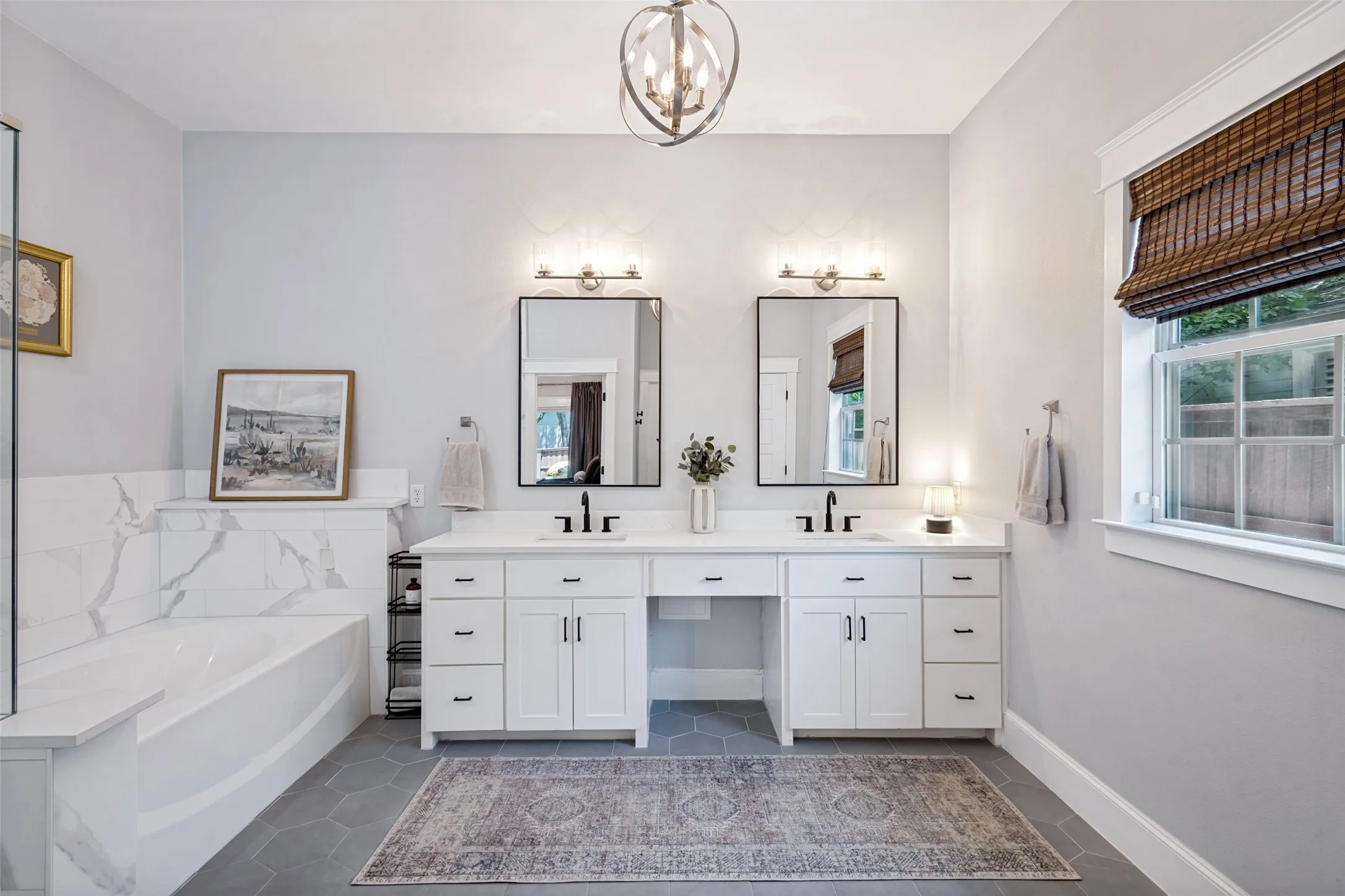 Dual vanity with white cabinetry, quartz countertops, and matte black fixtures