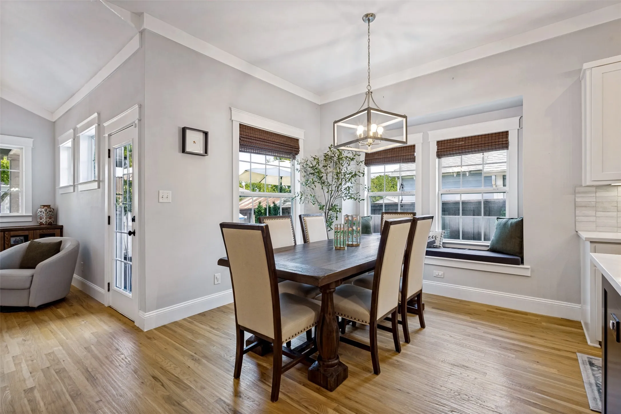Wood-finish flooring, recessed lighting, and a built-in window seat