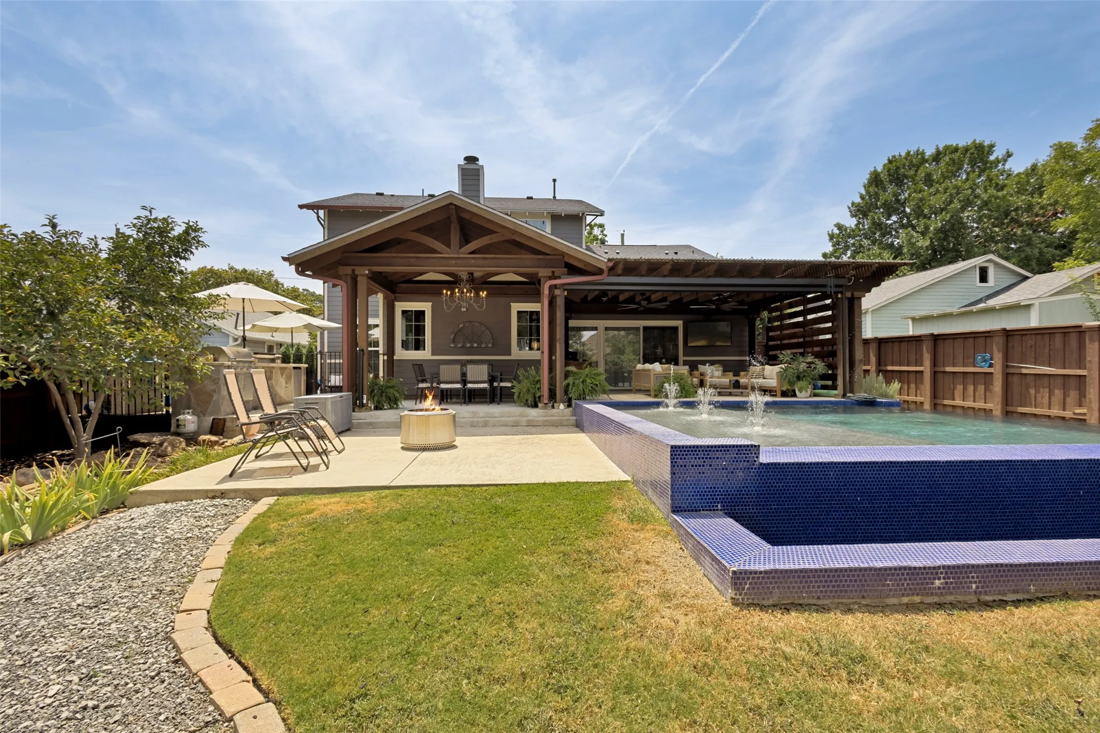 Swimming pool with mosaic tile finish and water features
