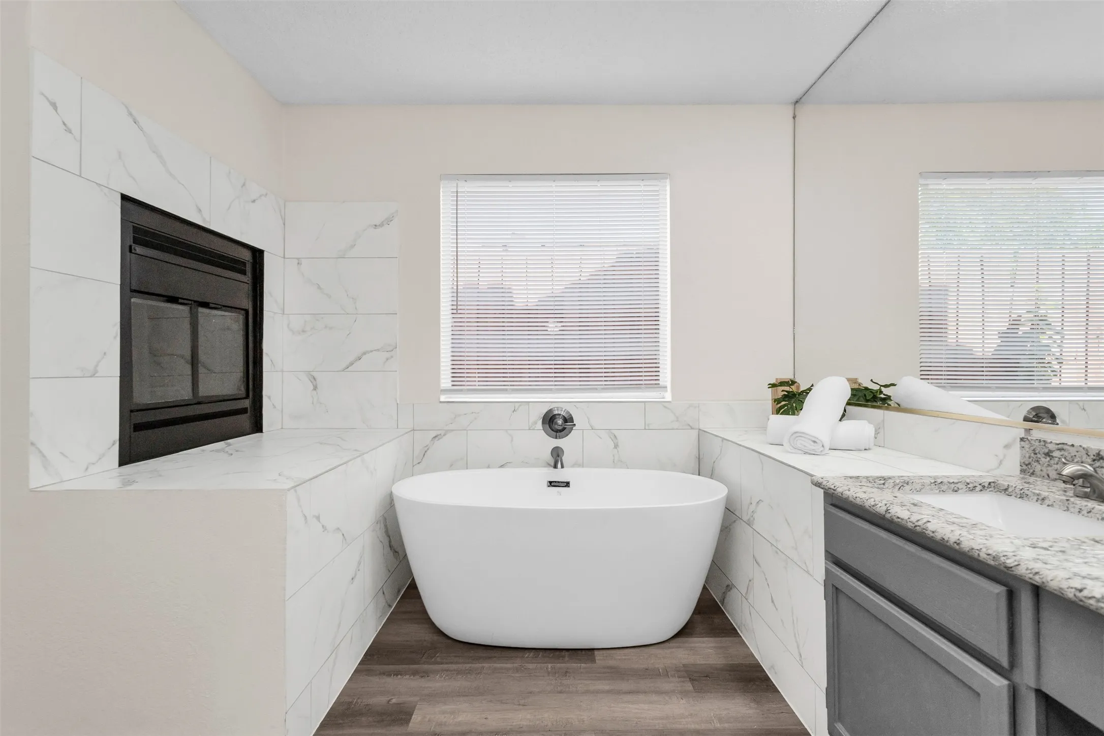Fireplace between bedroom and bathroom