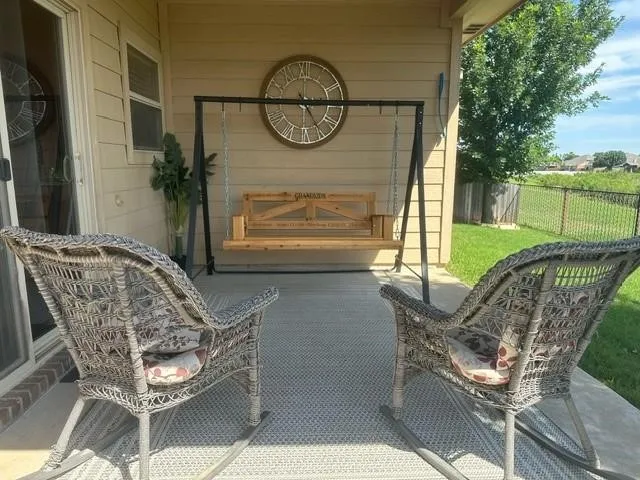 View of patio with fence