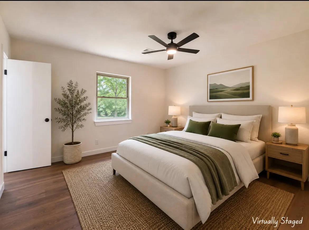 Bedroom featuring wood-finish flooring, a contemporary ceiling fan with integrated lighting, and a window providing natural illumination