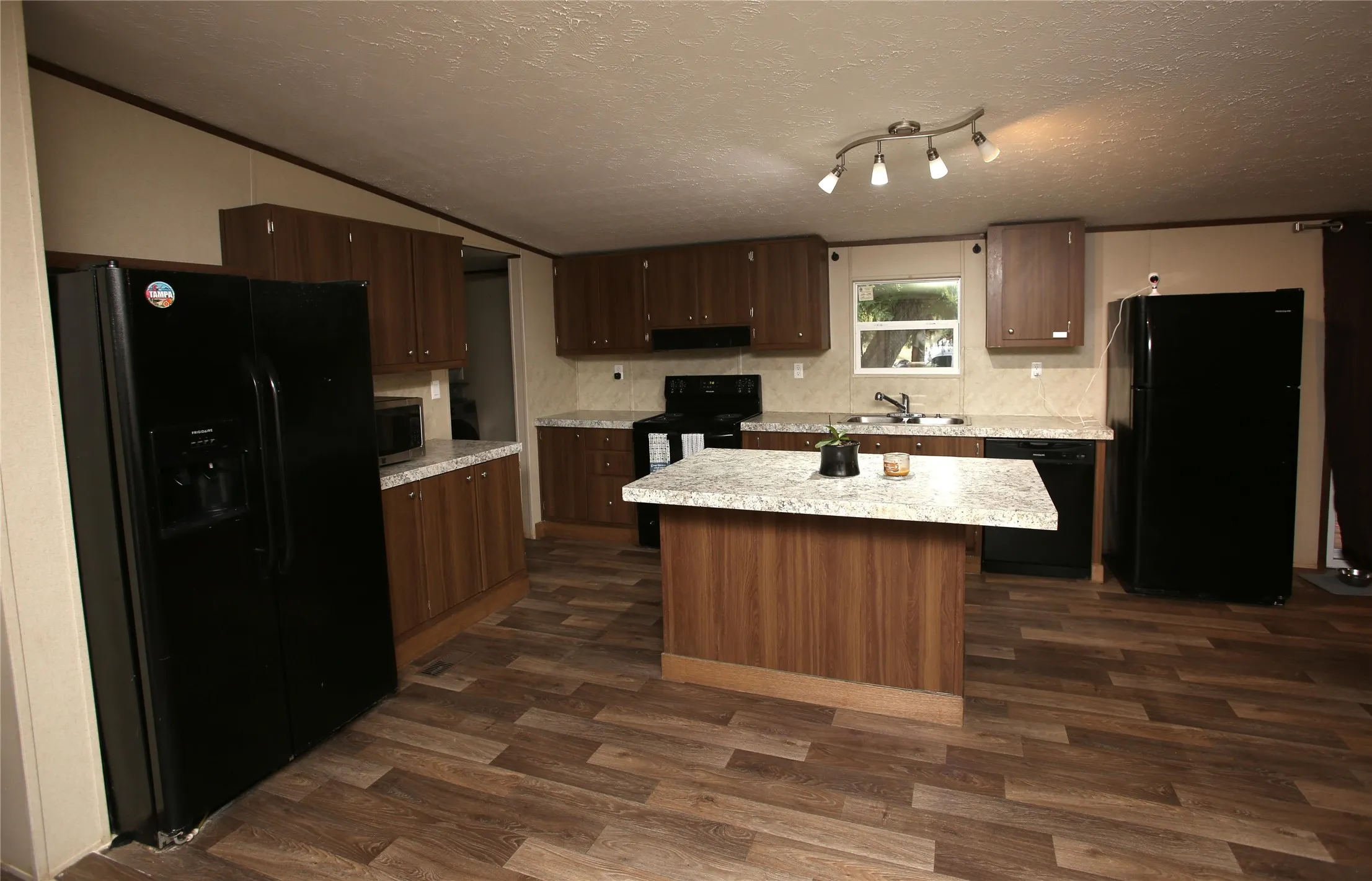 Open concept kitchen with island.