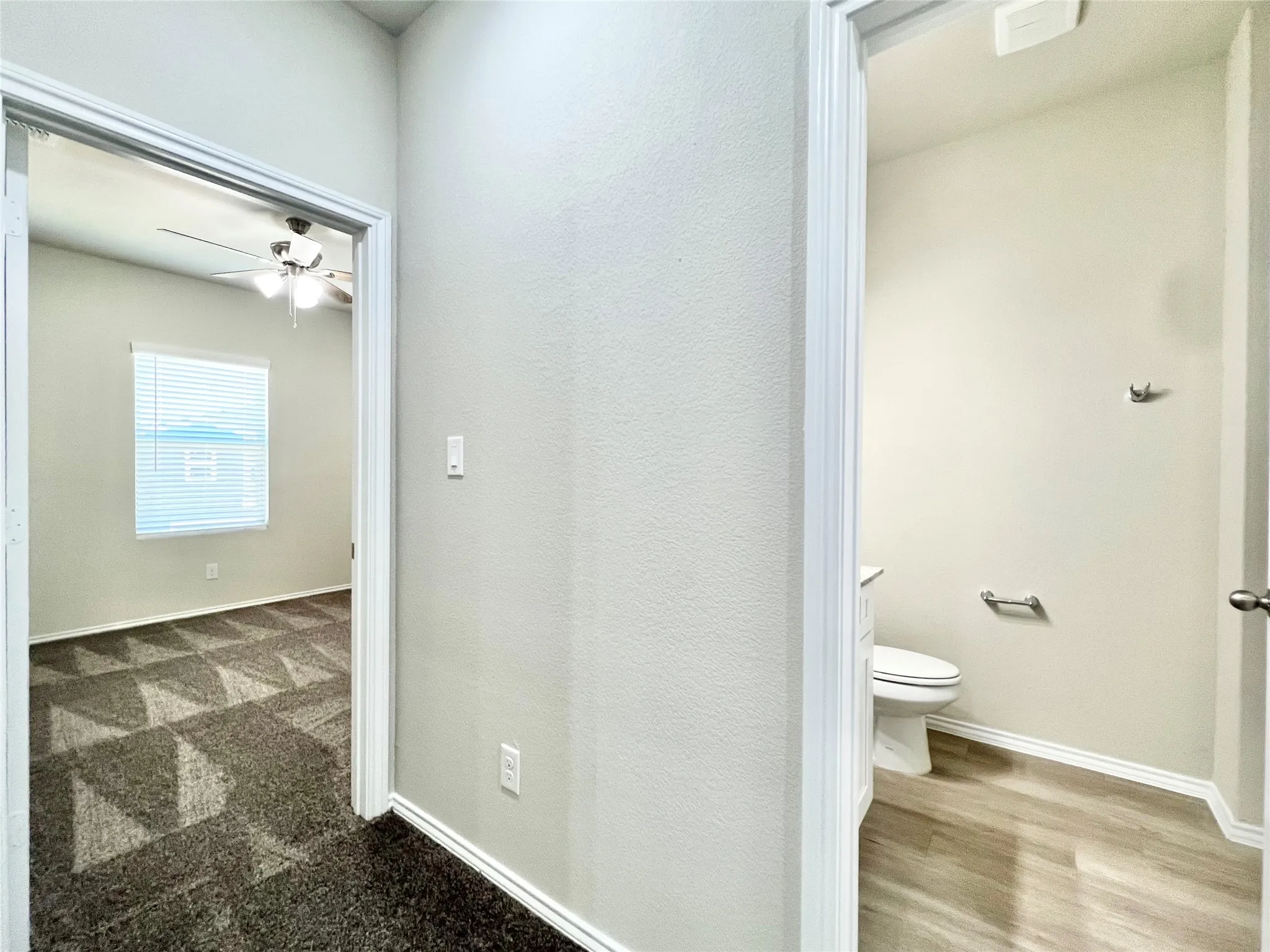 Hallway showing 3rd bedroom and full bath