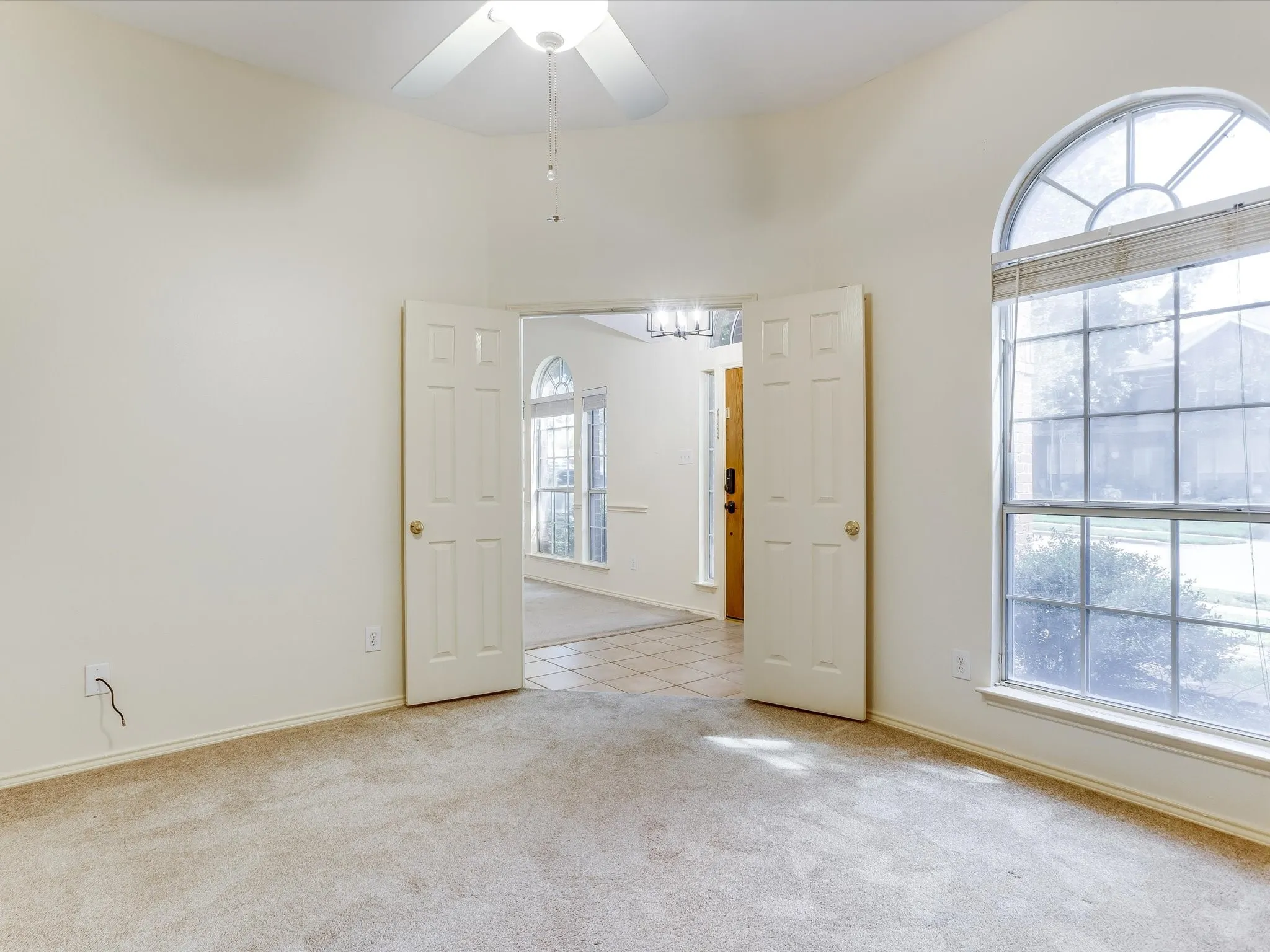 Flex room, office, or extra bedroom off of the front of the home