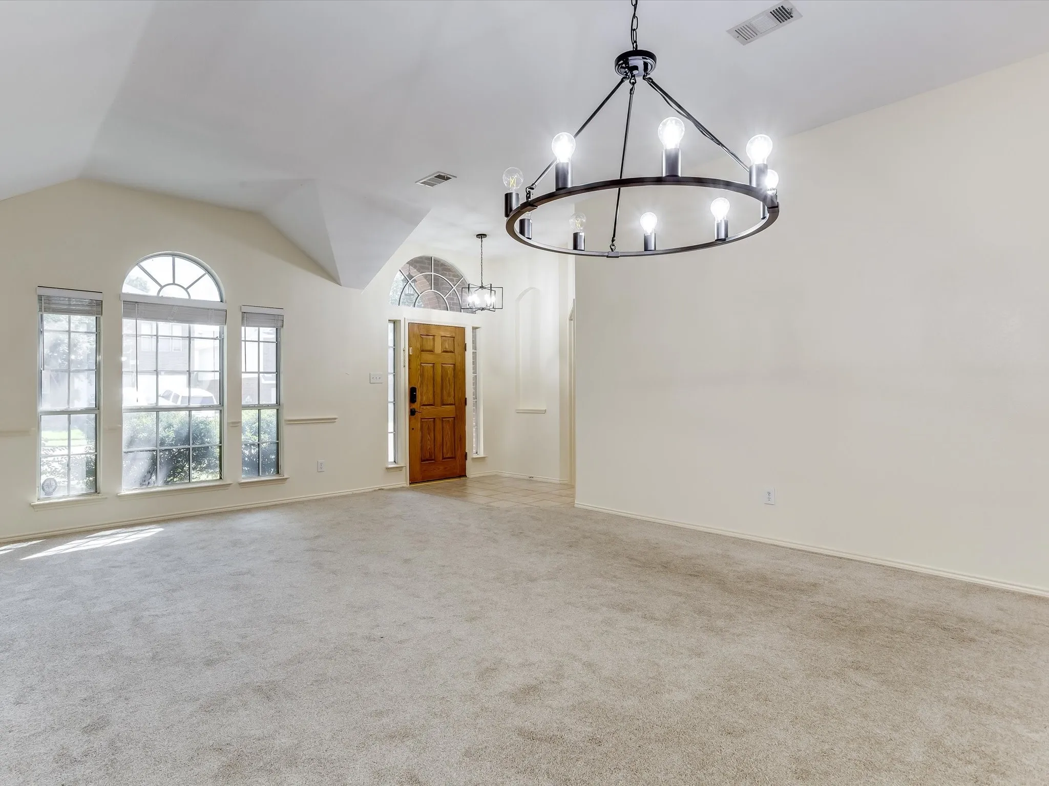 Entry way, living room, and formal dining room. Lots of natural lights