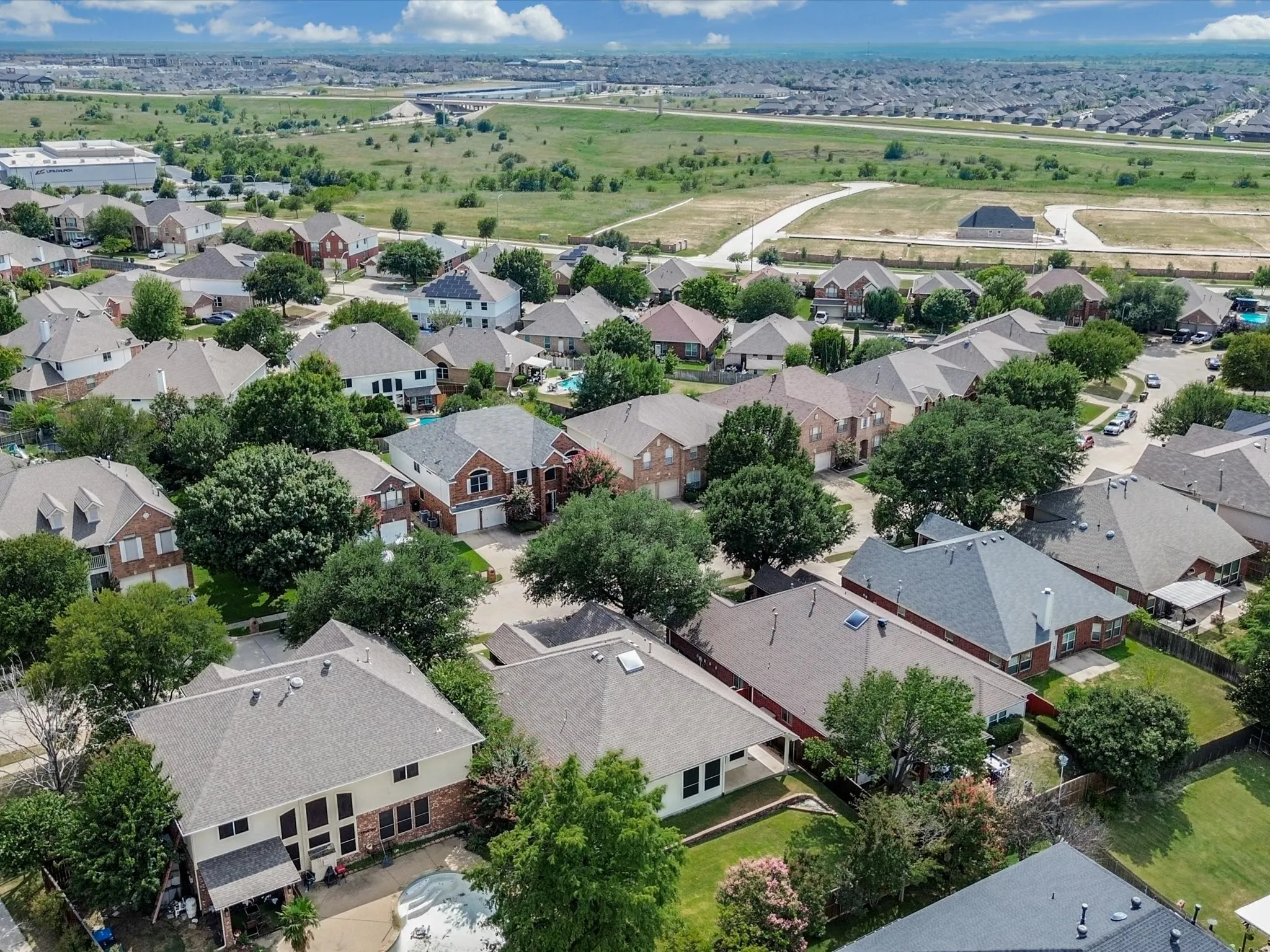 Aerial perspective showcasing a residential area with varied housing styles