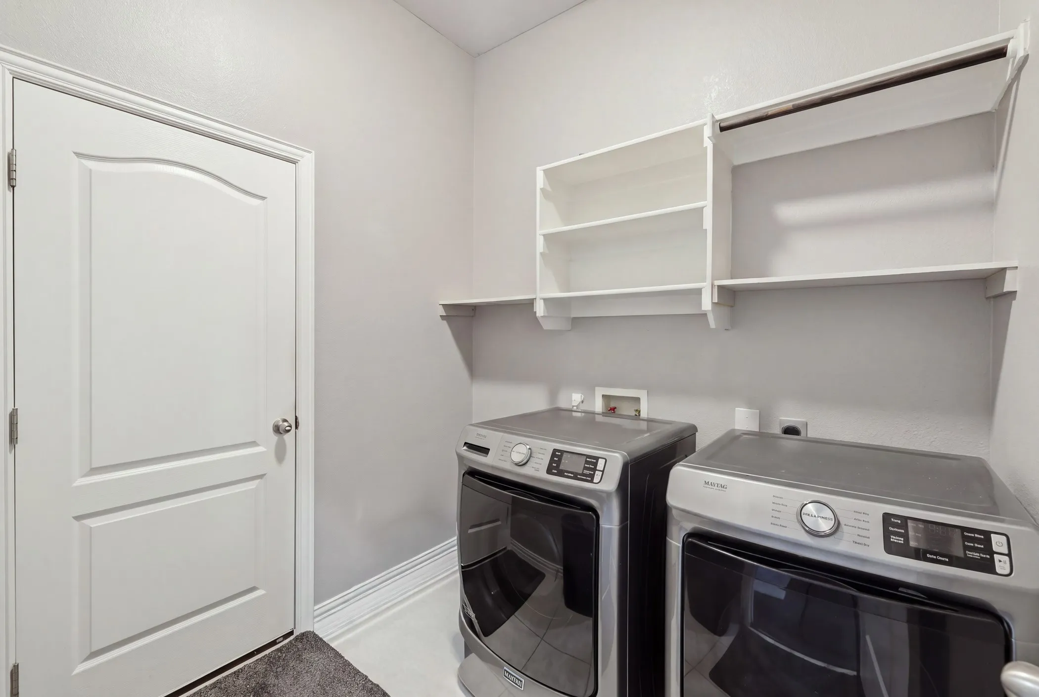 Large laundry room located off the garage entry
