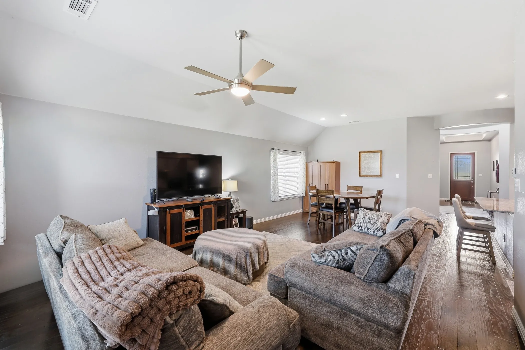 Living room looking towards the dining area and front entry way