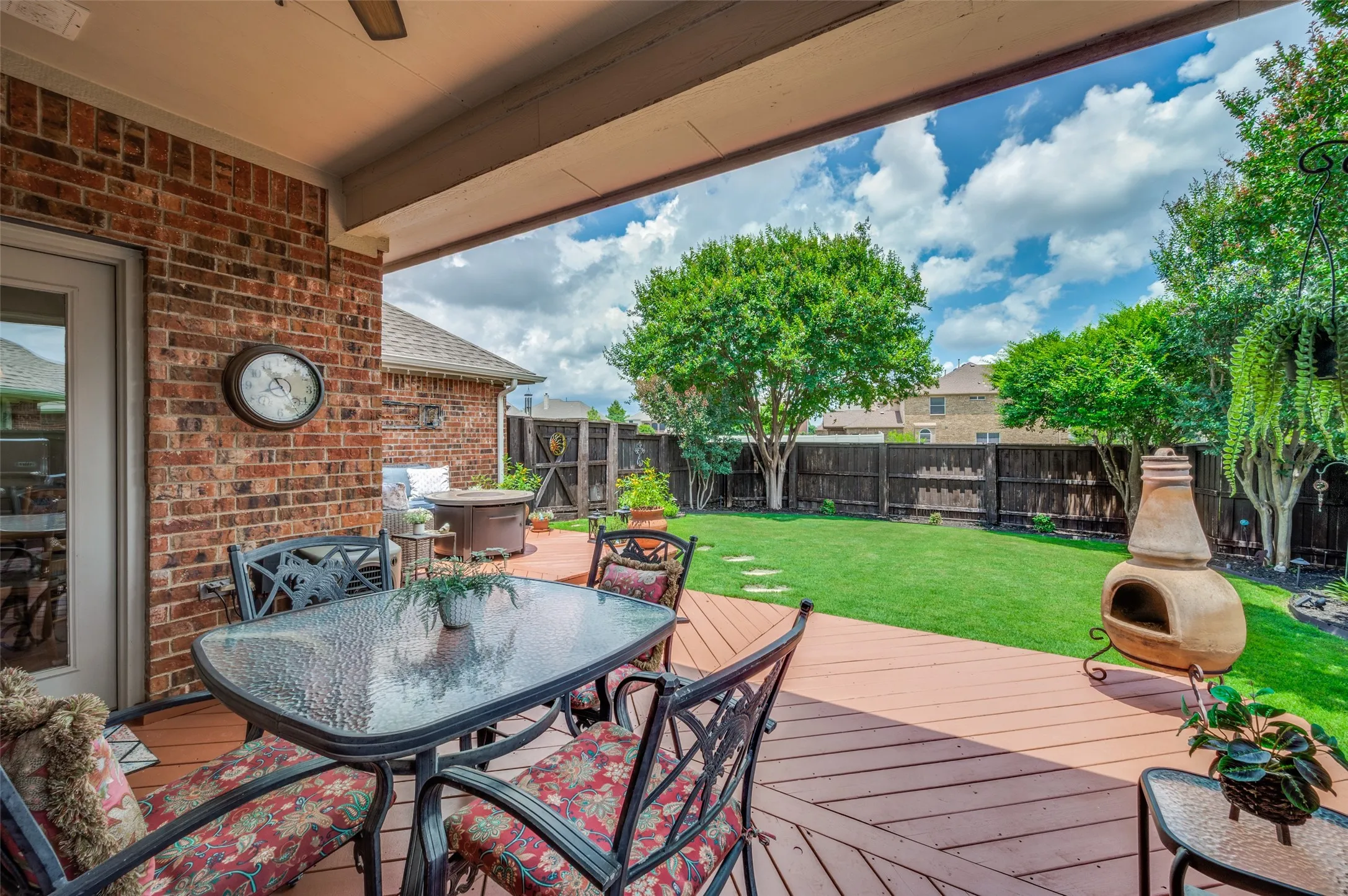 Relax on the covered patio plumbed for a gas grill!