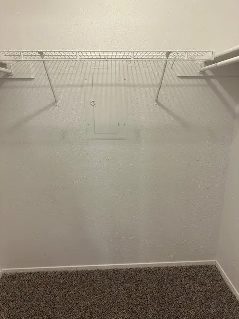 Walk in closet in secondary bedroom