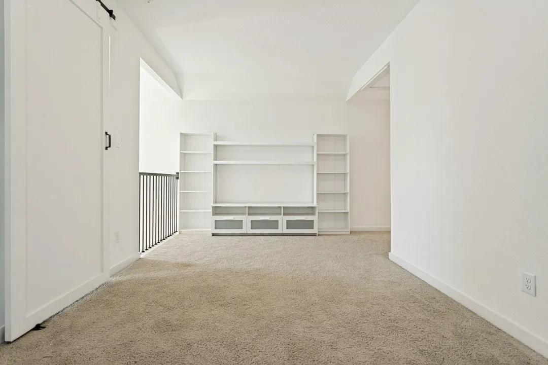 Built-in media center with shelving and lower cabinetry