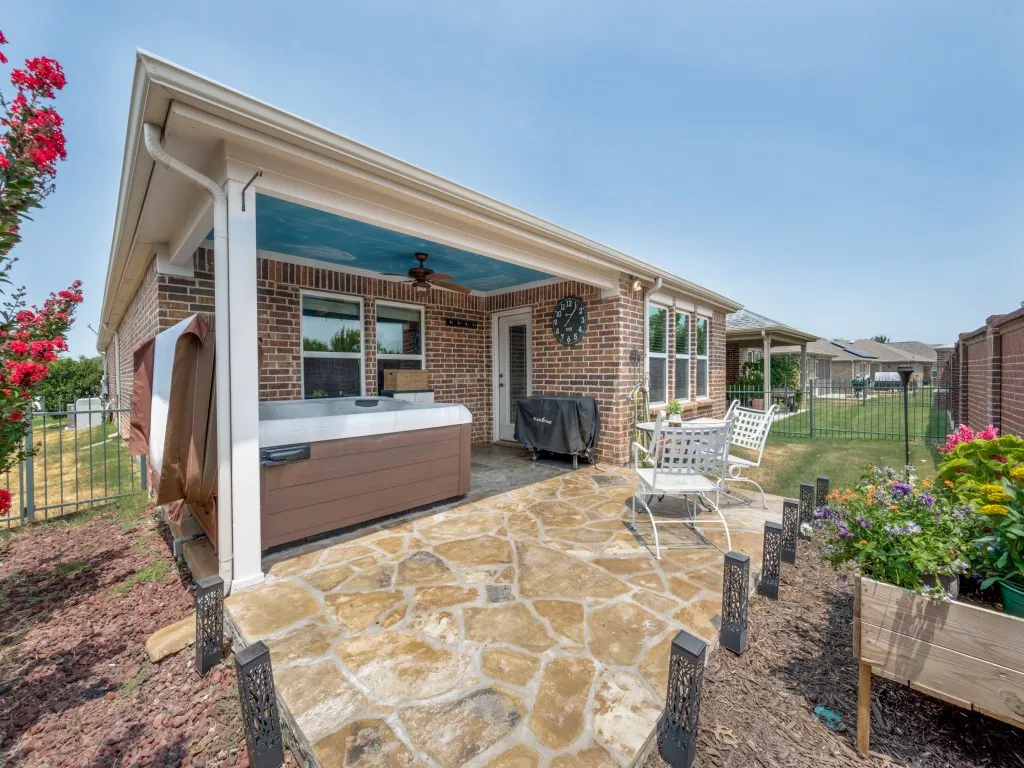The brick fence and spa cover offers complete privacy for a relaxing evening in your own hot tub!