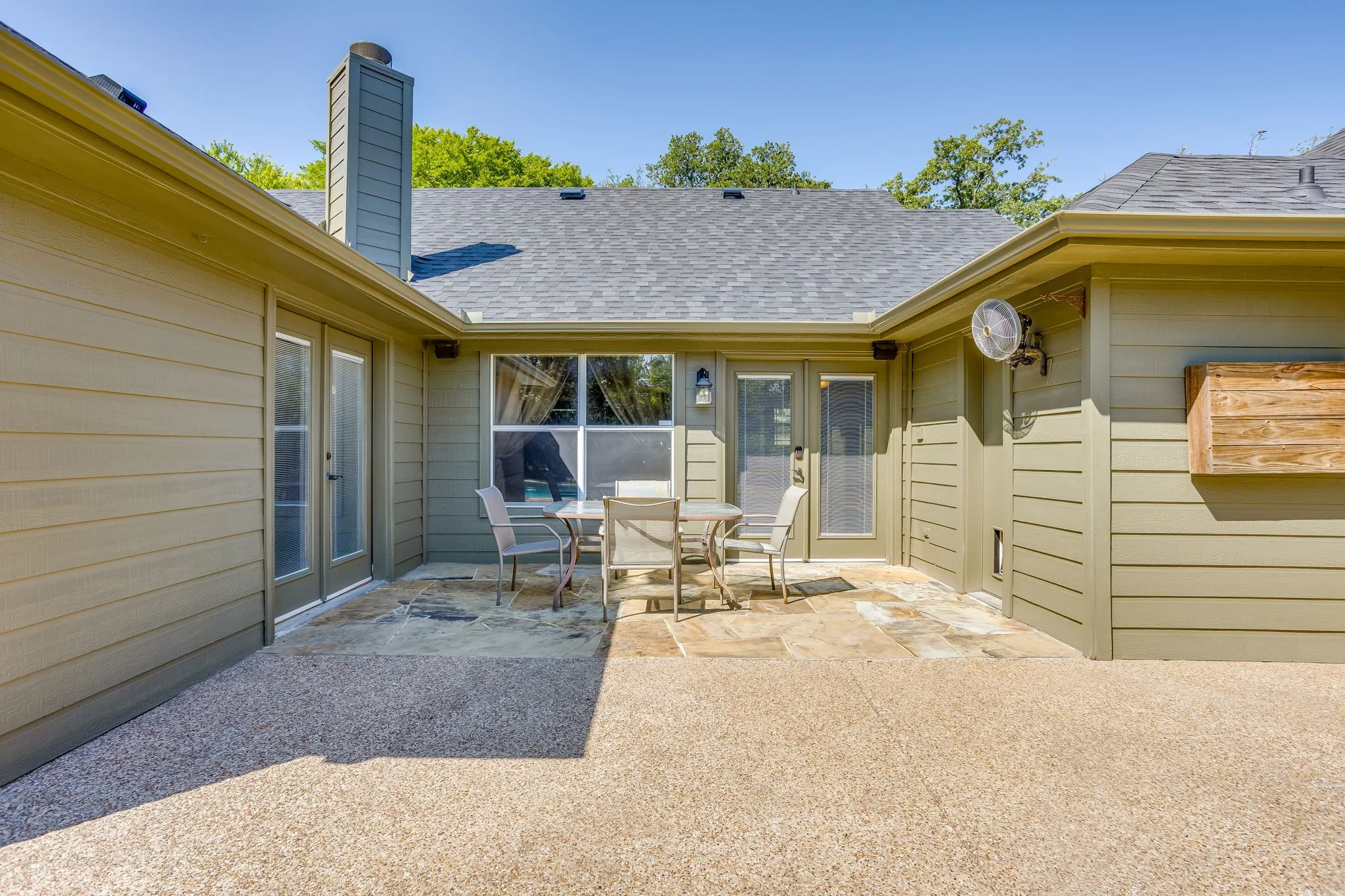 There are 3 direct entry's to the open patio that overlooks the pool and a magnificent view of the treeline.