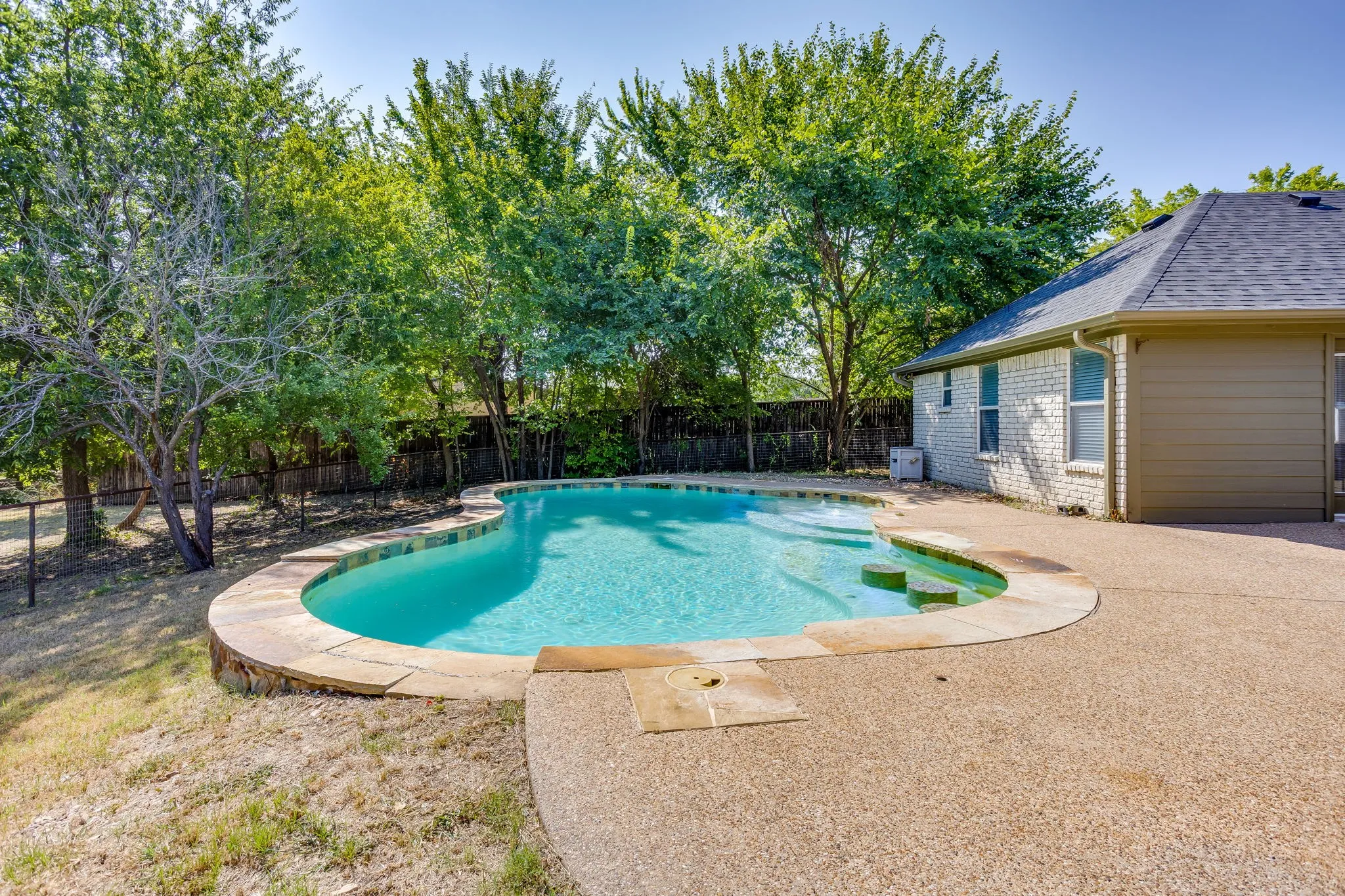 In-ground gunite pool with bar stool seating