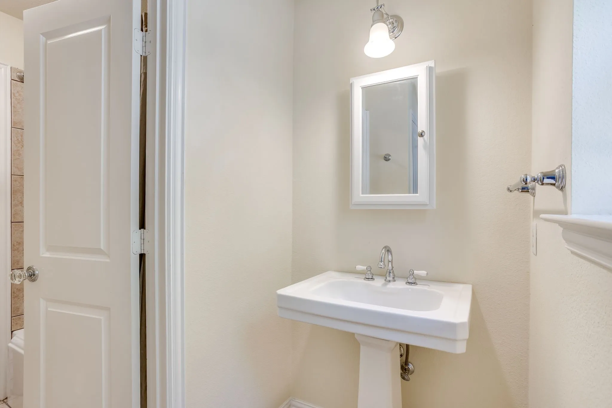 Pedastal sink, medicine cabinet and linen closet in the Jill