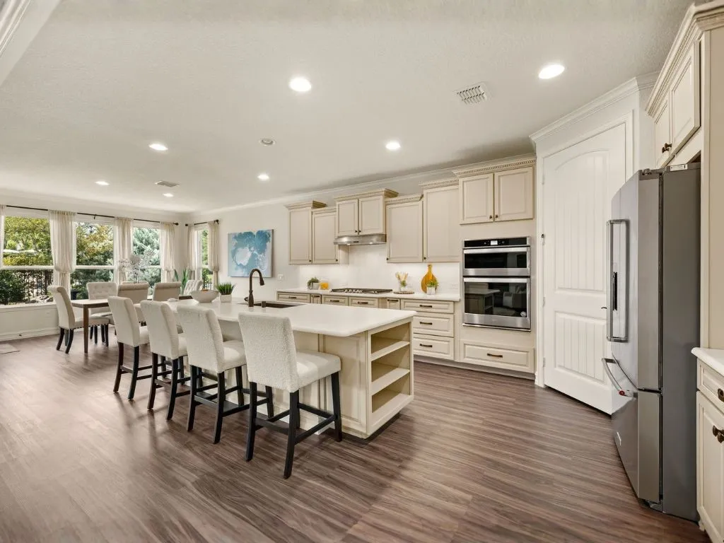 Custom cabinetry with pull out drawers and built in appliances