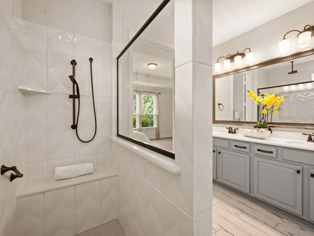 Huge walk-in shower with body sprayer and ceiling rain fixture