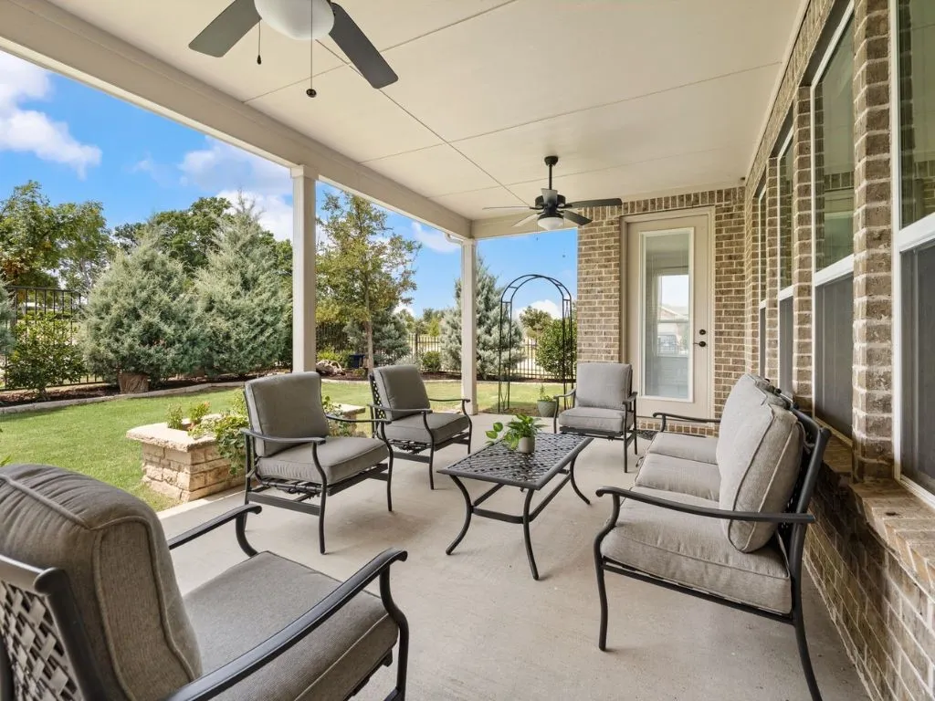 Large covered patio with green belt view!