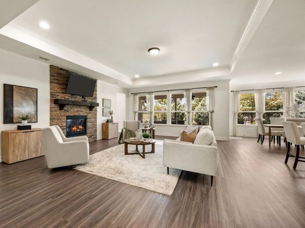 Tray ceiling and stacked stone fireplace in Gathering Room