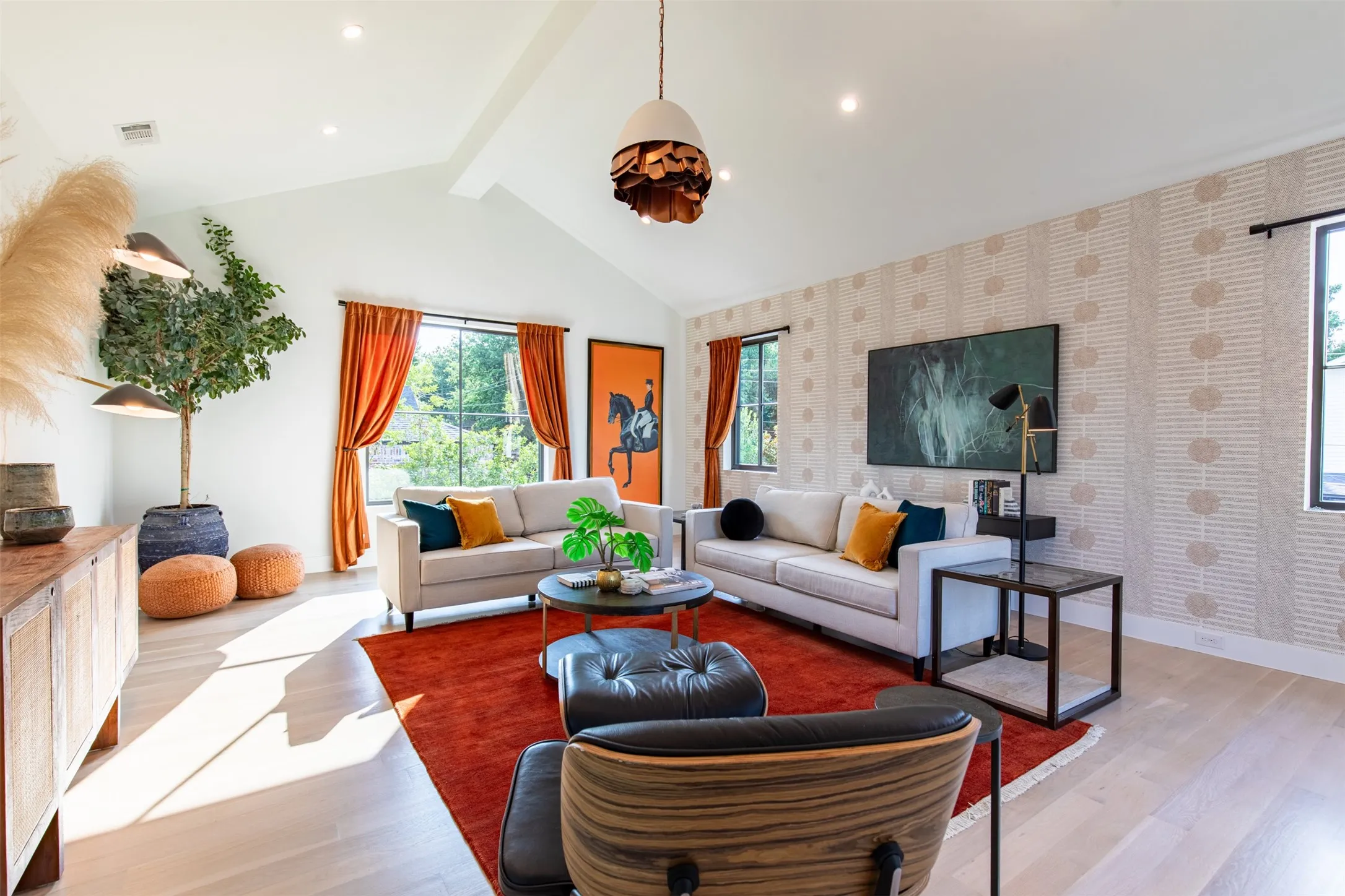 Vaulted ceiling with exposed beam and recessed lighting