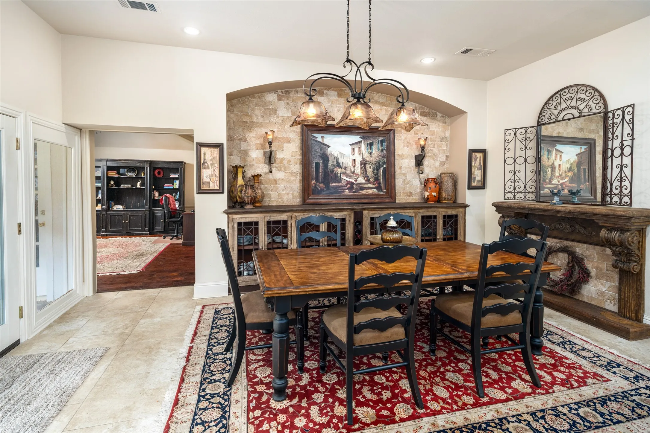 Dining room with recessed lighting, arched walkways, and light tile patterned floors