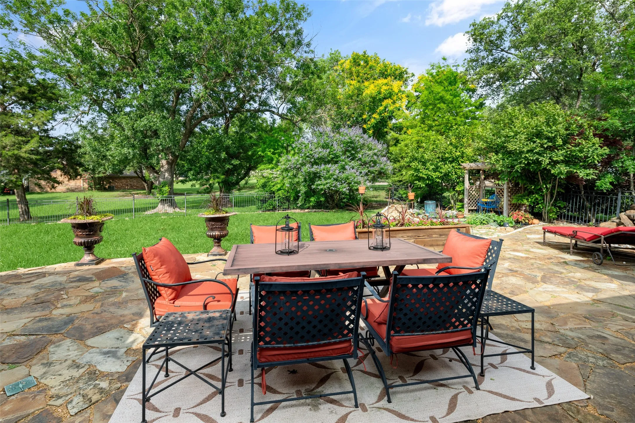 View of patio featuring outdoor dining area and view of scattered trees