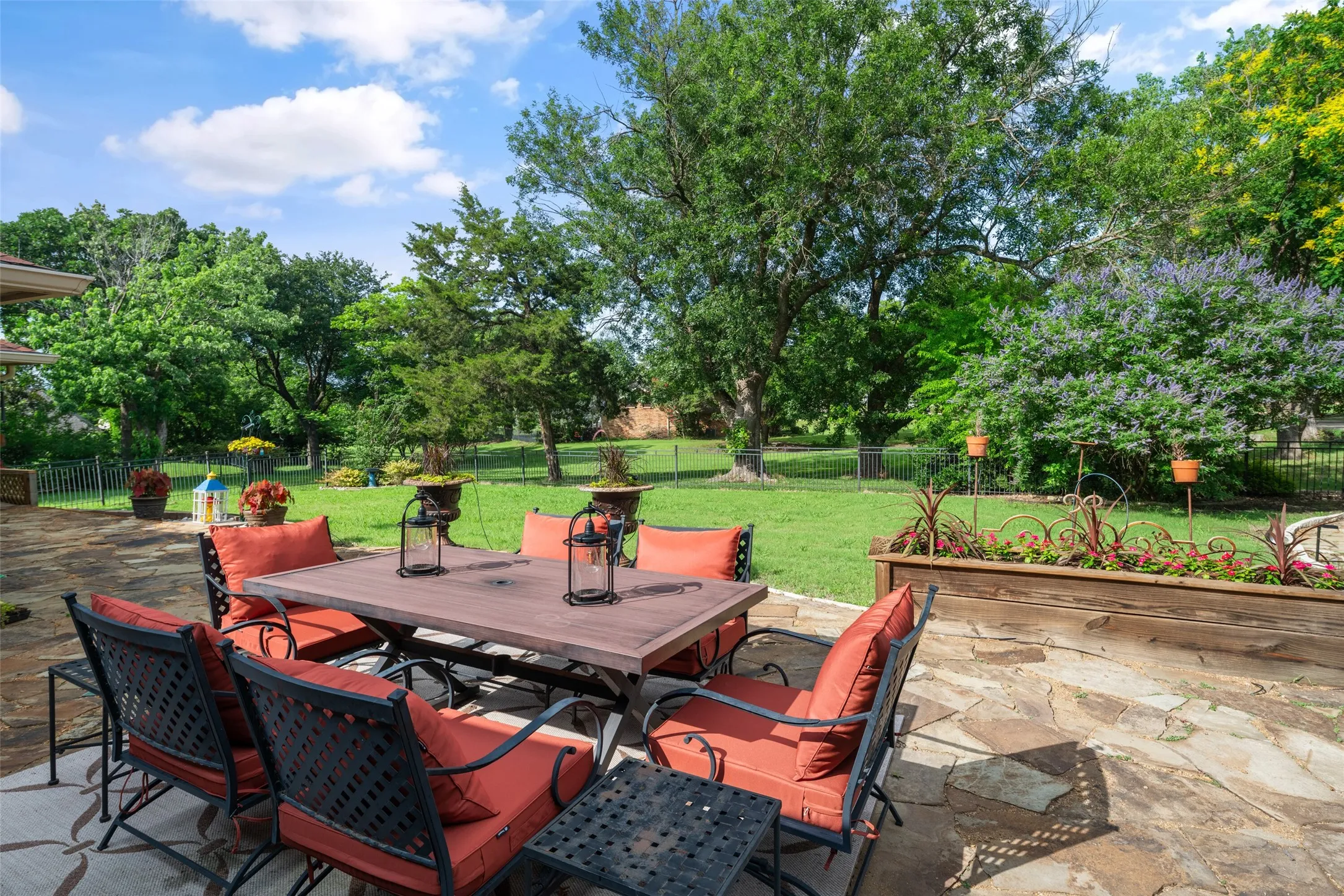 View of patio featuring outdoor dining area and view of scattered trees