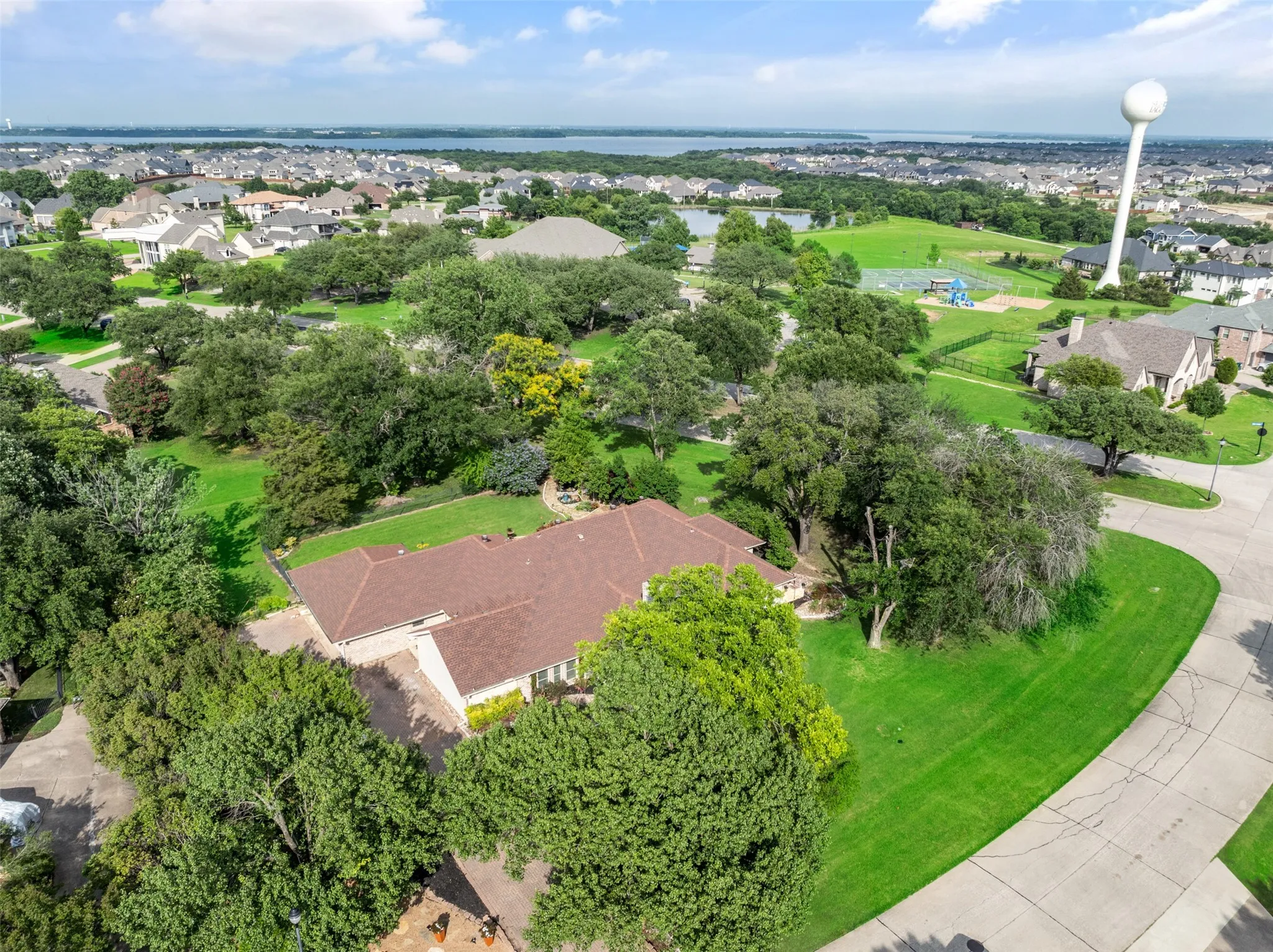 Aerial view of residential area featuring a large body of water