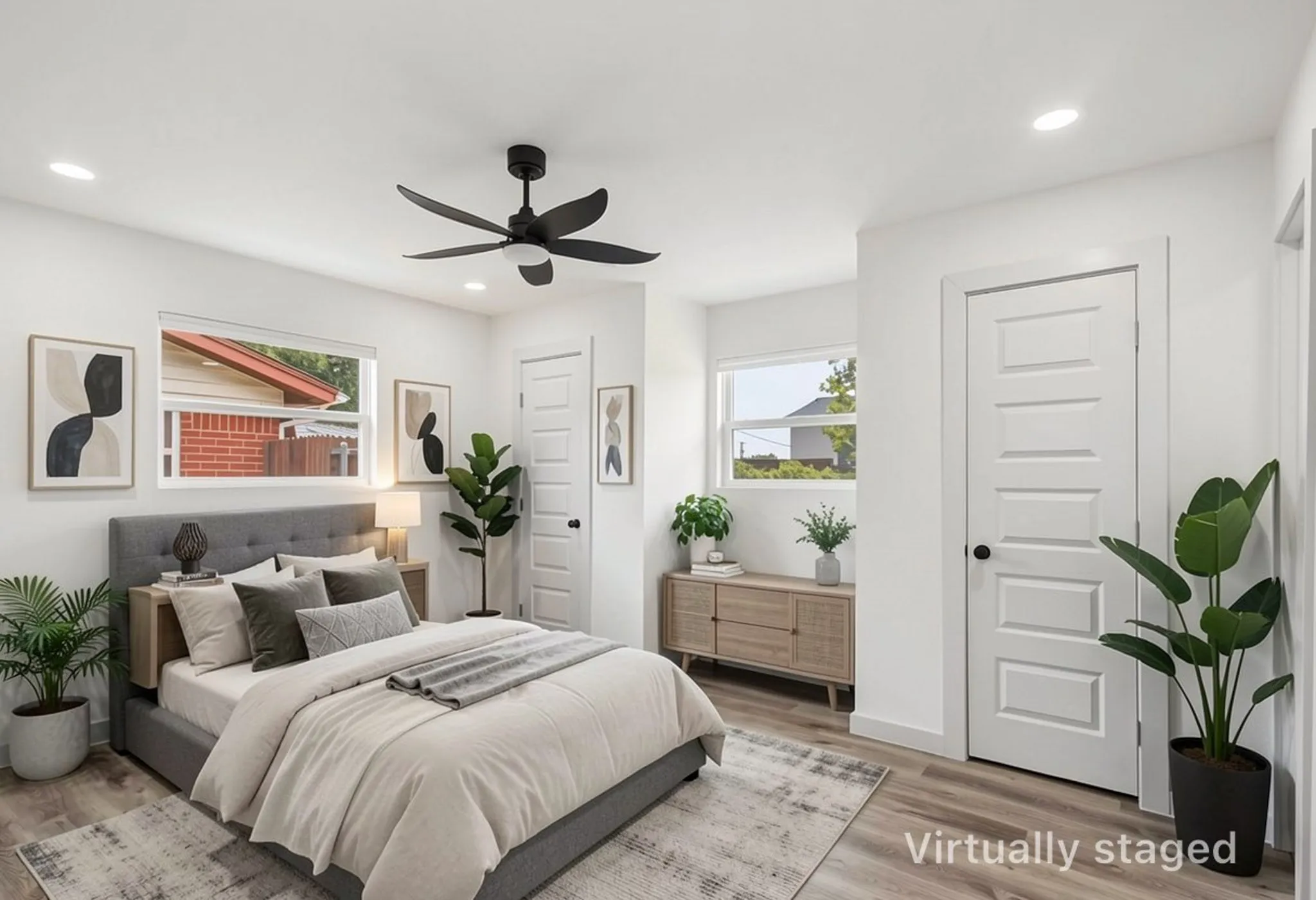 Light-filled room featuring wood-finish flooring, recessed lighting, a modern ceiling fan, and white five-panel interior doors