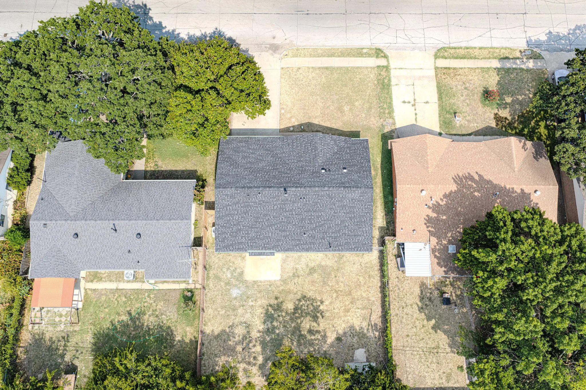 Property featuring a dark shingle roof and a partially covered rear patio