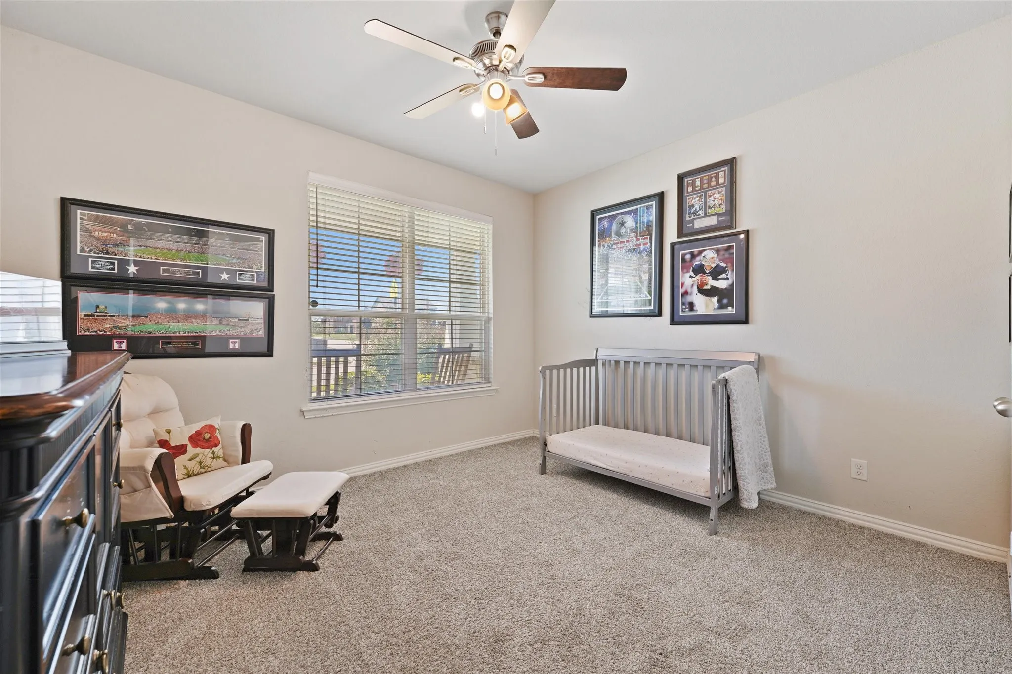 Light-filled room featuring neutral wall paint and plush carpeting