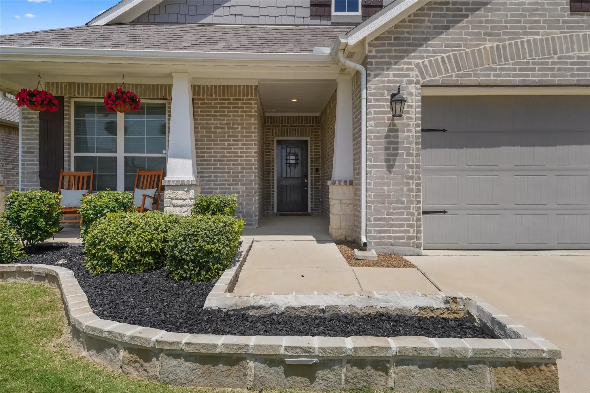 Brick veneer exterior with shingle siding accents