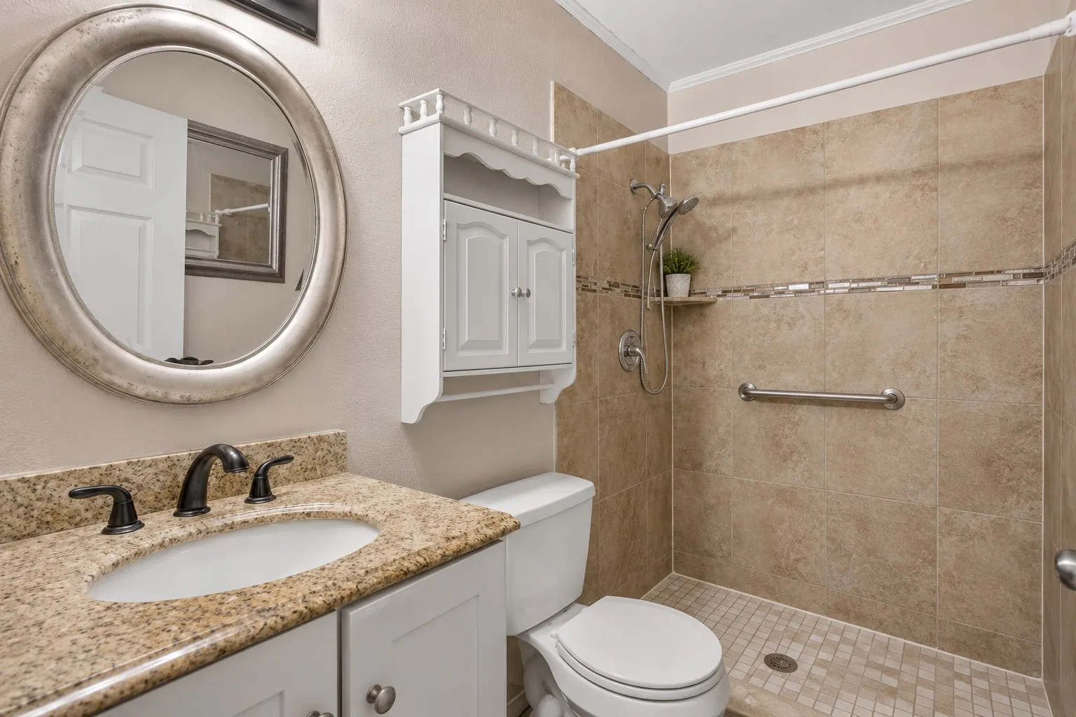 Granite vanity with an undermount sink and oil-rubbed bronze faucet