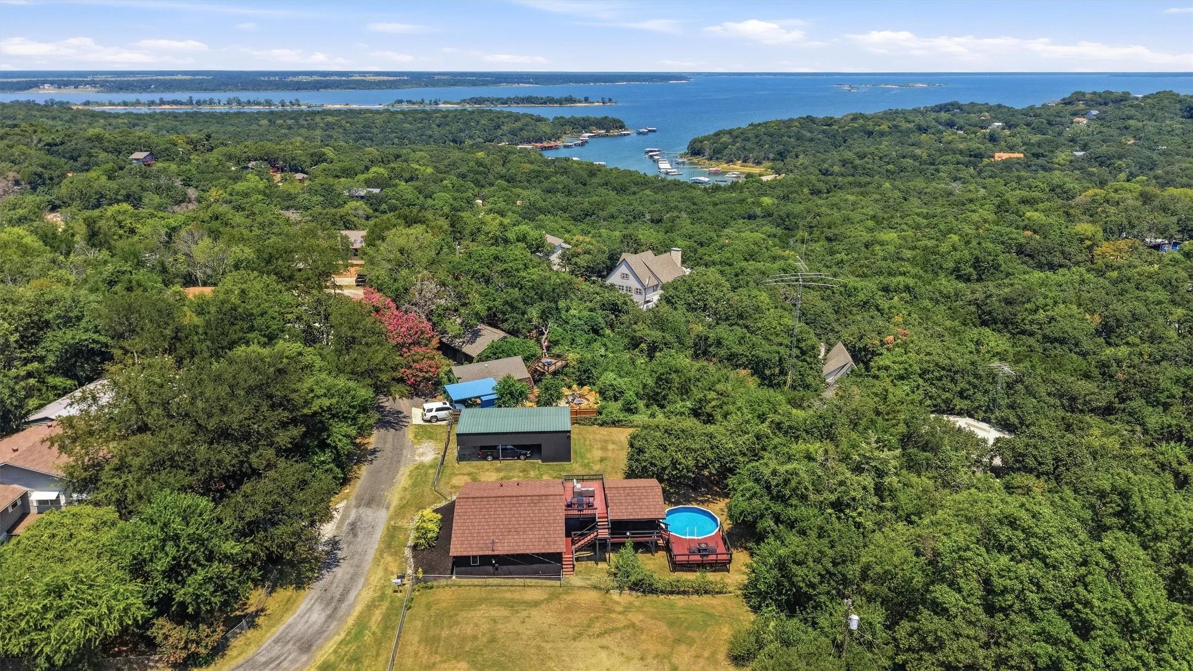 Aerial perspective showcasing a body of water and lush green surroundings