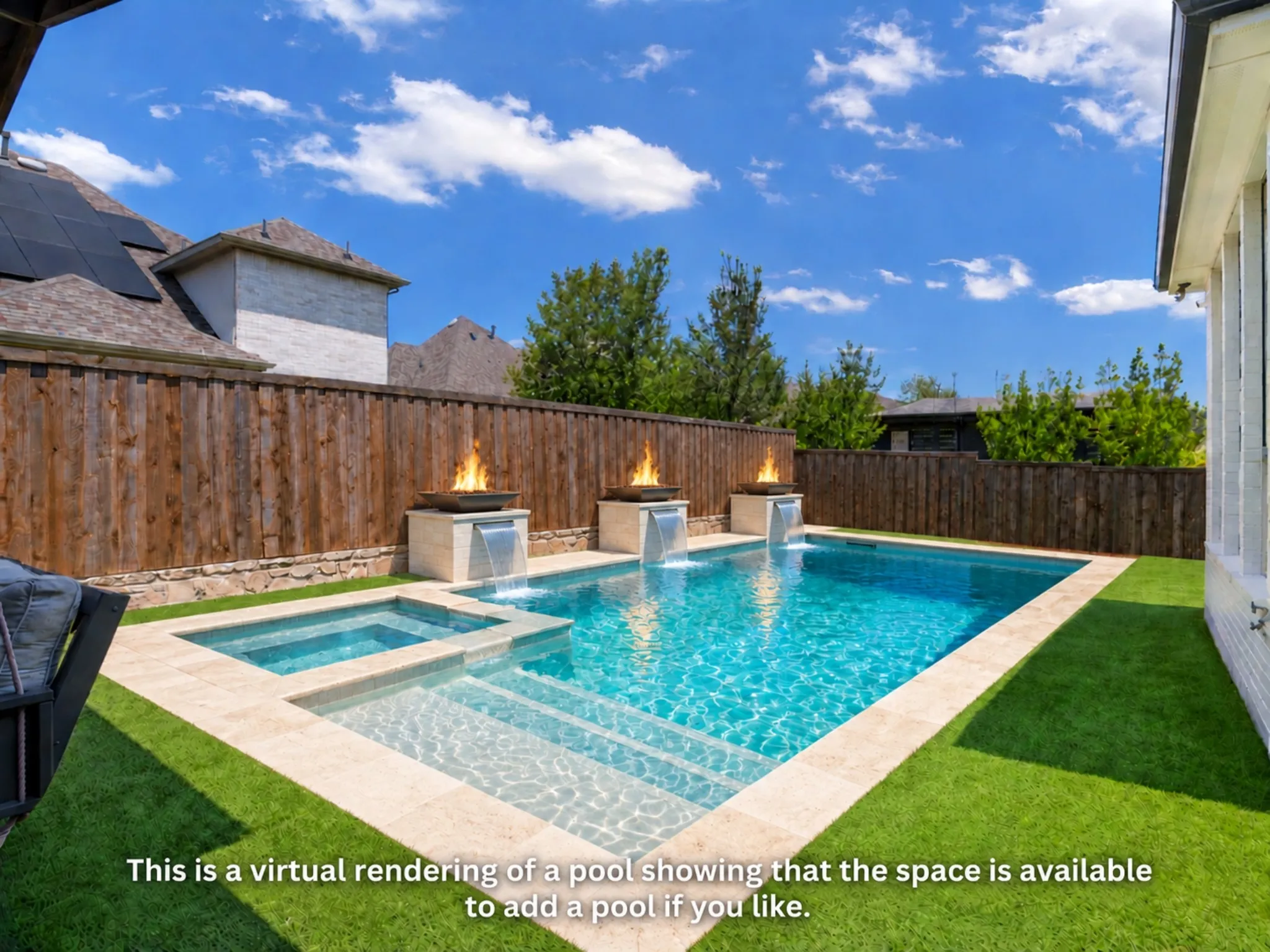 Private outdoor space featuring a wood fence, artificial turf, and a stone-trimmed perimeter