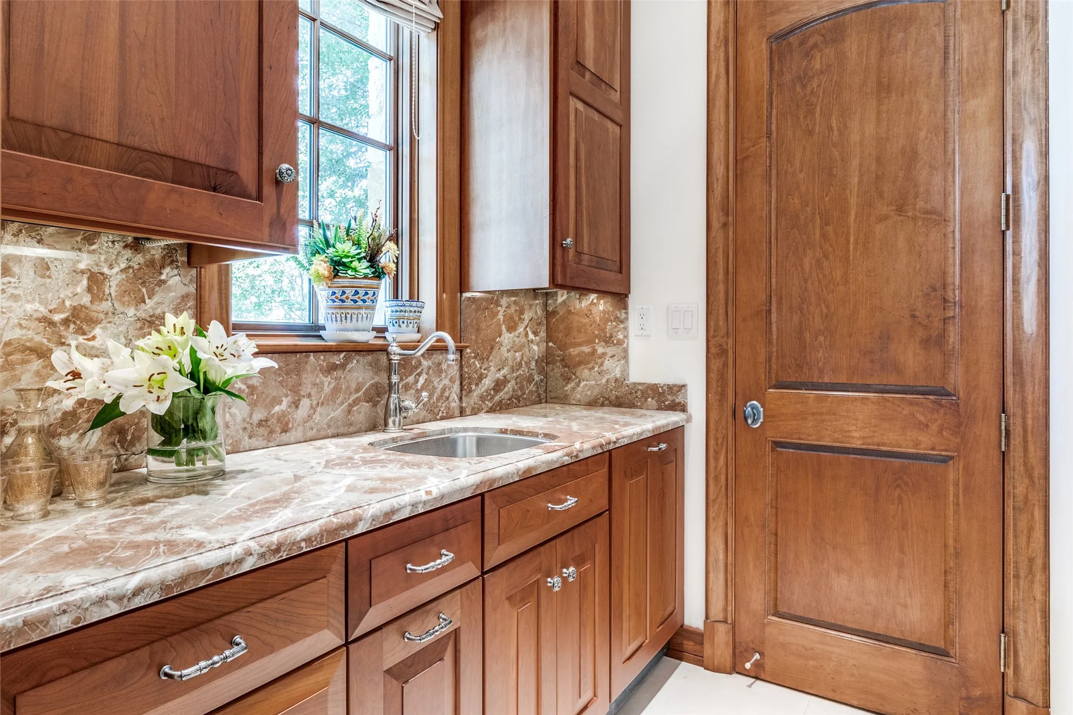 Serving Pantry with Full Dishwasher and Custom Wood Cabinetry