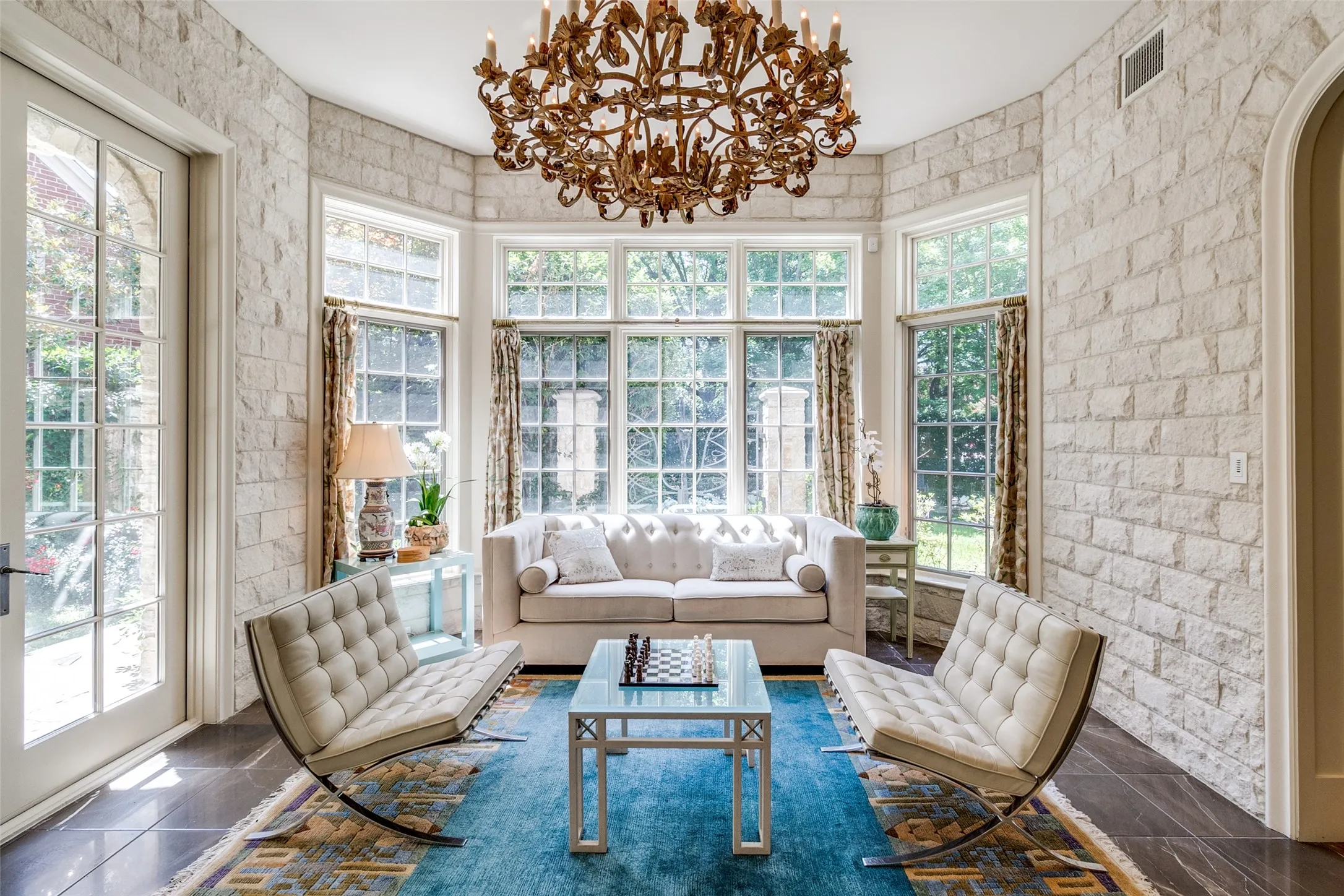 Morning Sunroom with Ann Sacks Tile Flooring and White Stone Walls